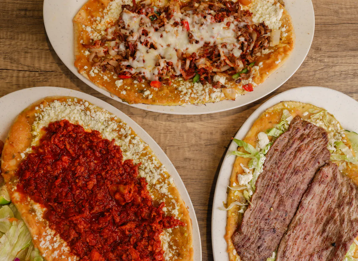 a plate of food with a slice of pizza