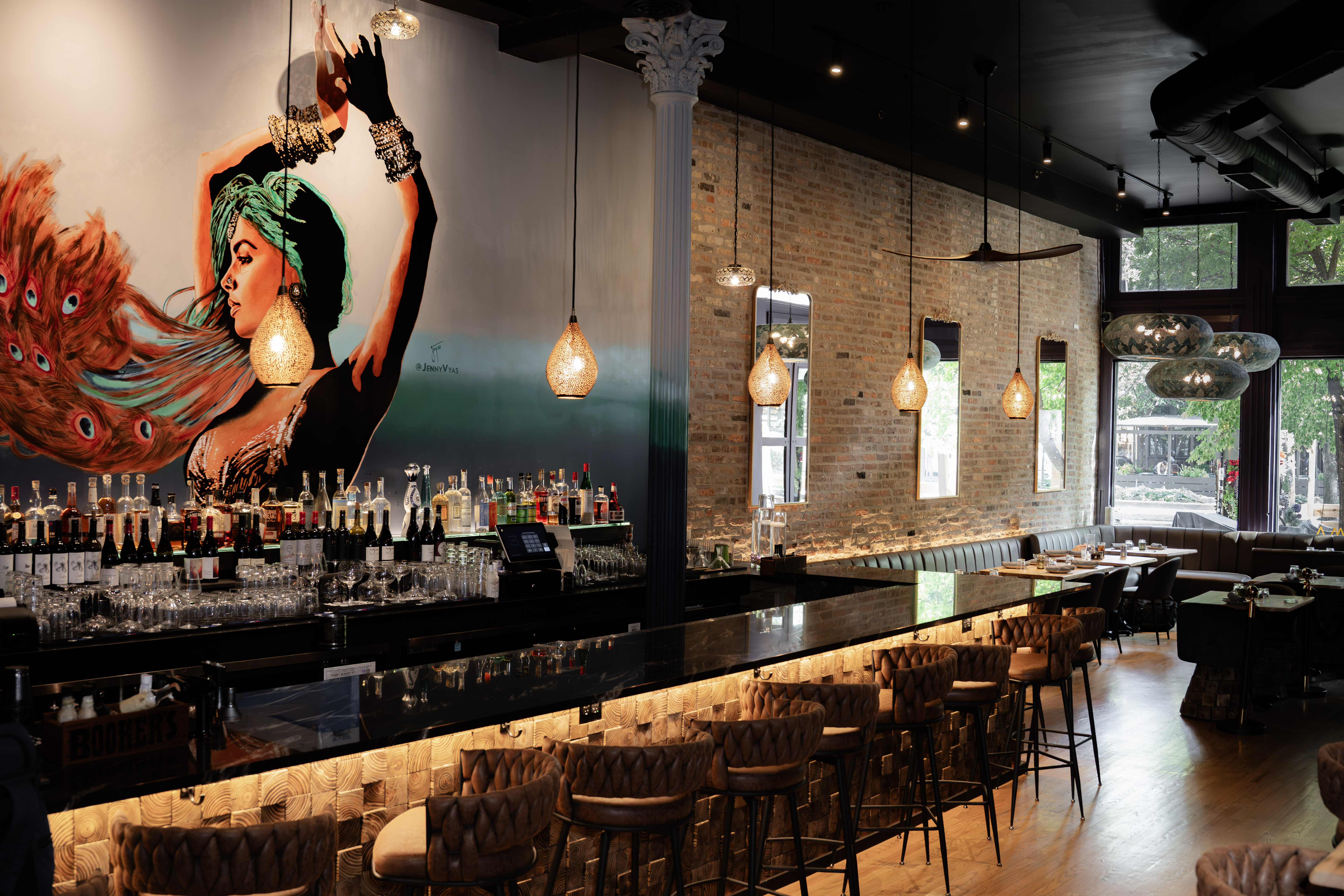a bar with a picture of a woman on the wall