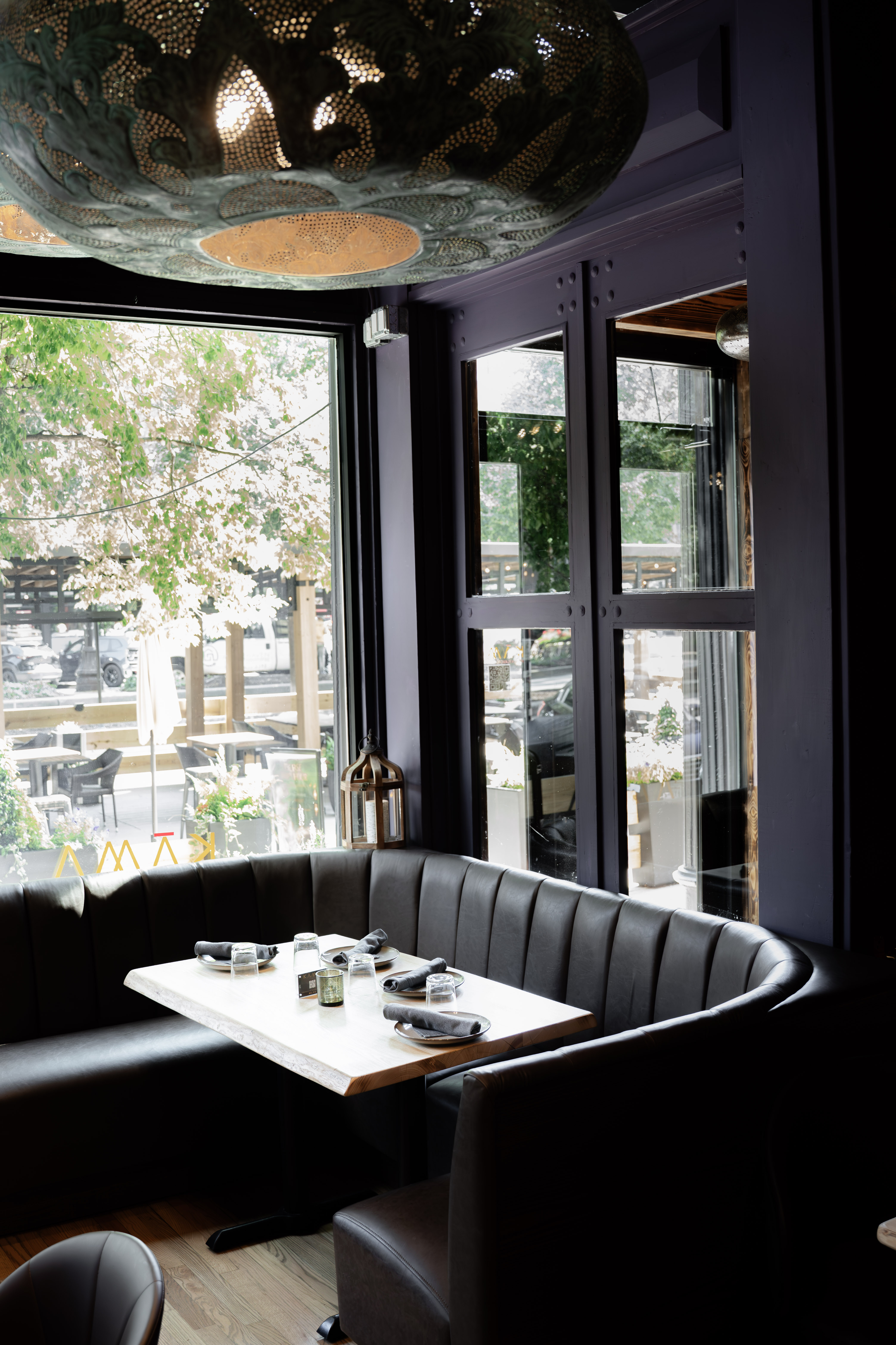 a booth seating with a table and a few other objects on it