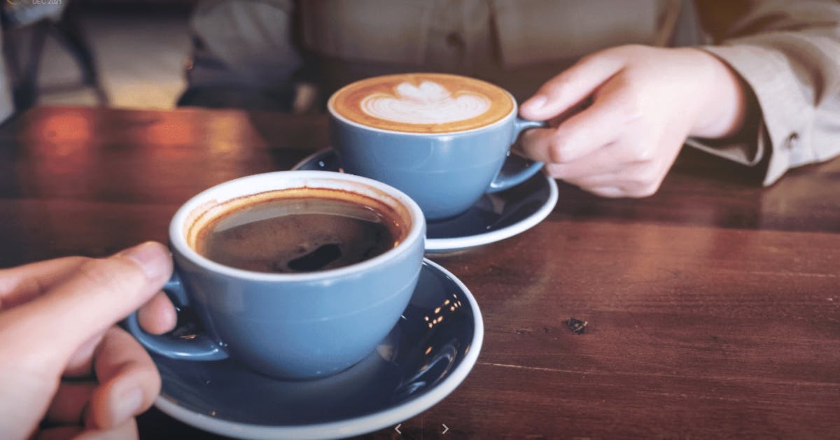 two cups of coffee on a table