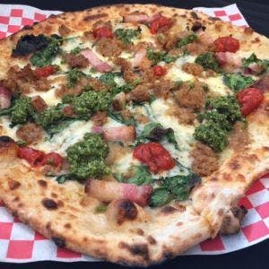 a pizza sitting on top of a table