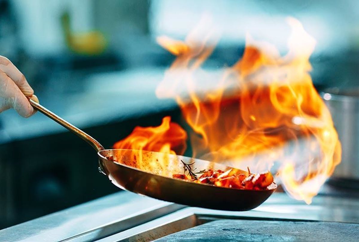 a bowl of food with a knife