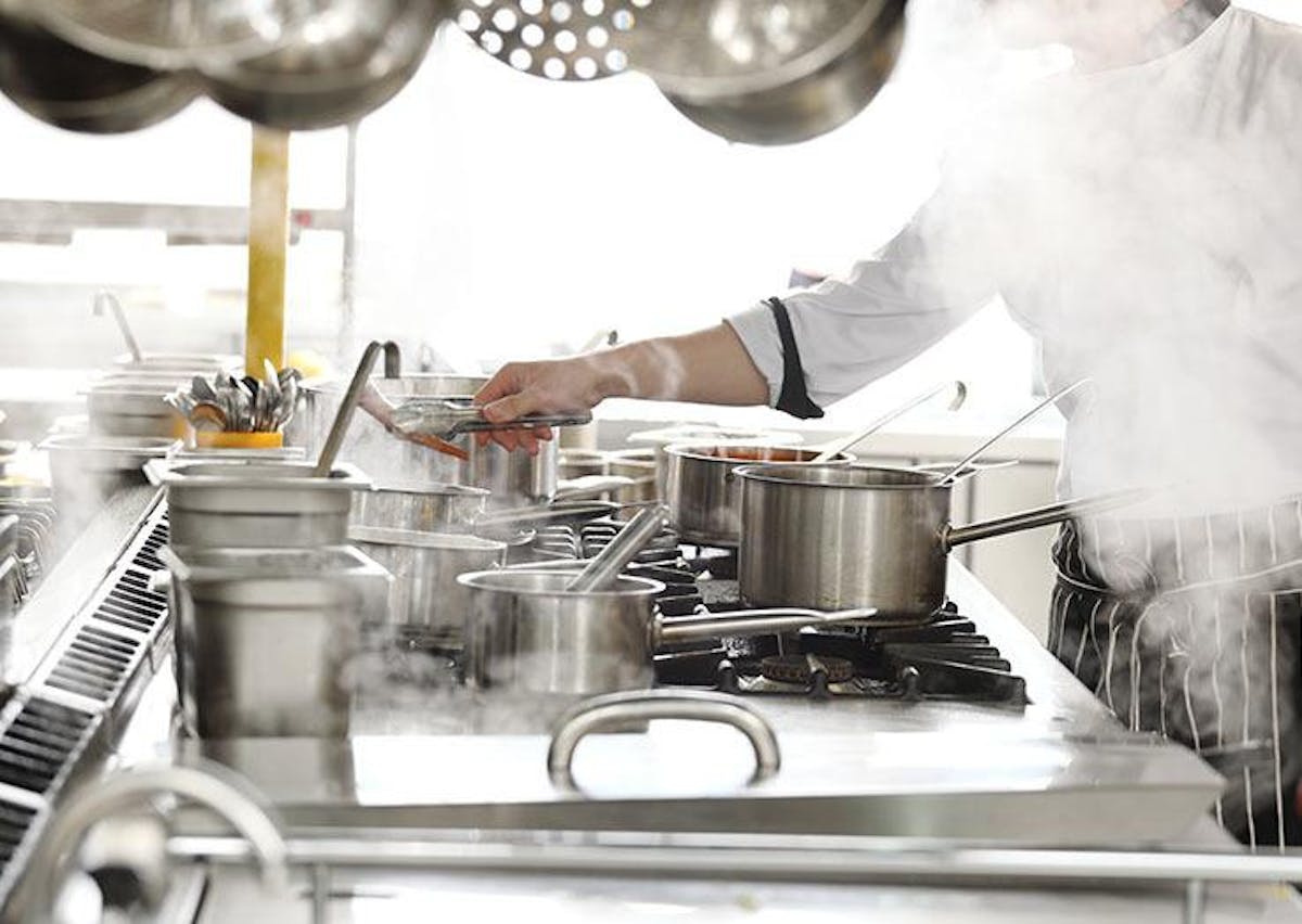 a person cooking in a kitchen