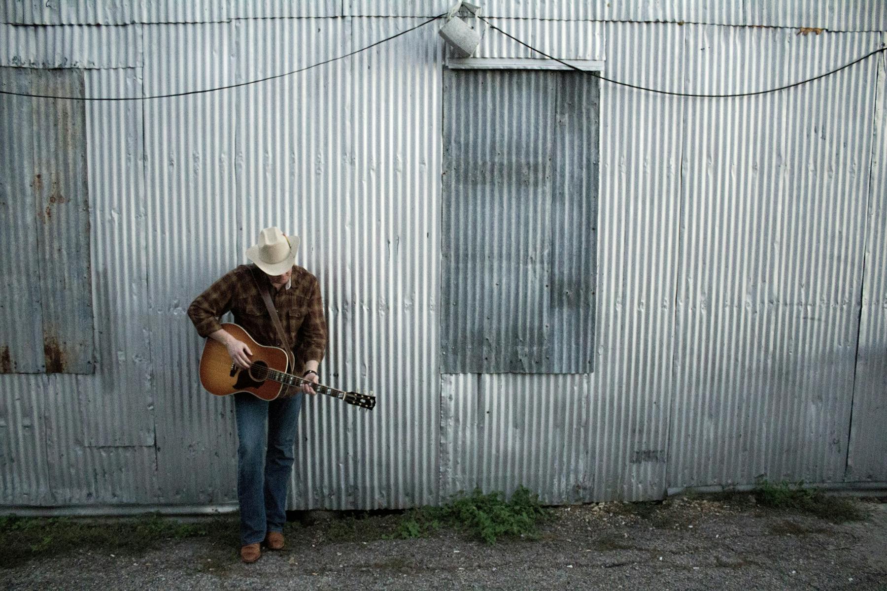 a man standing in front of a building