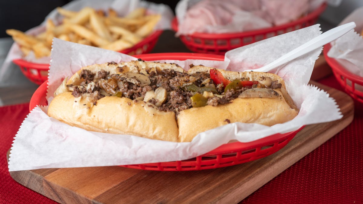a hot dog wrapped in a paper tray