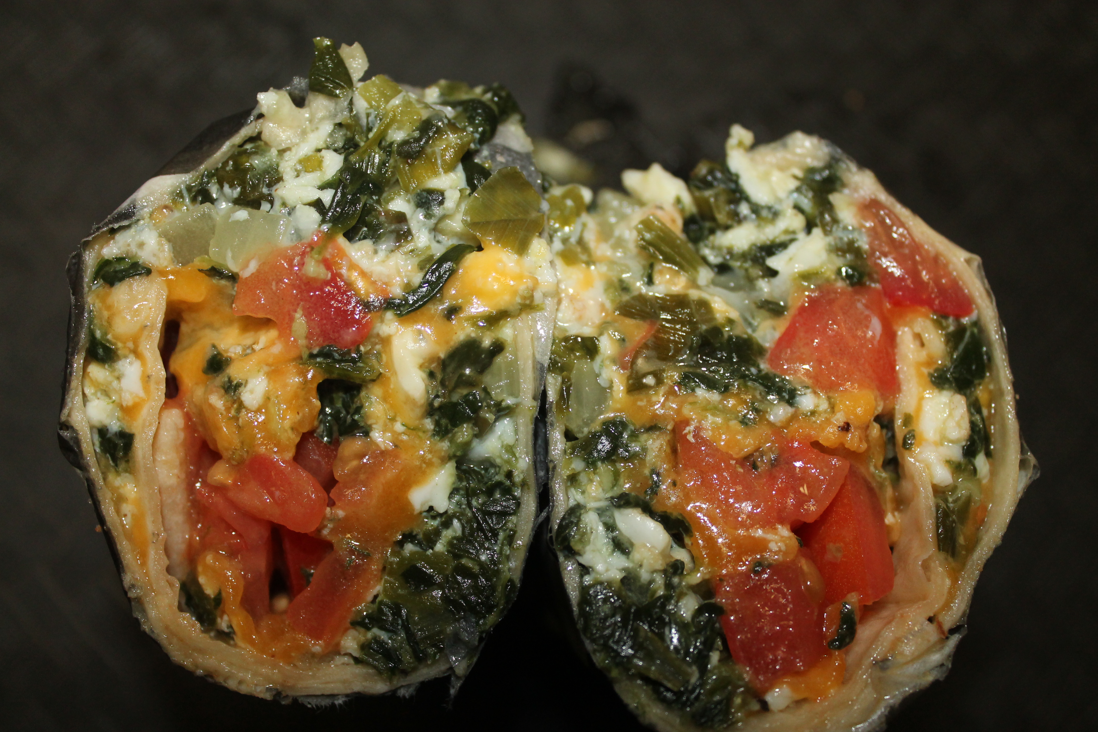 a close up of a piece of pizza