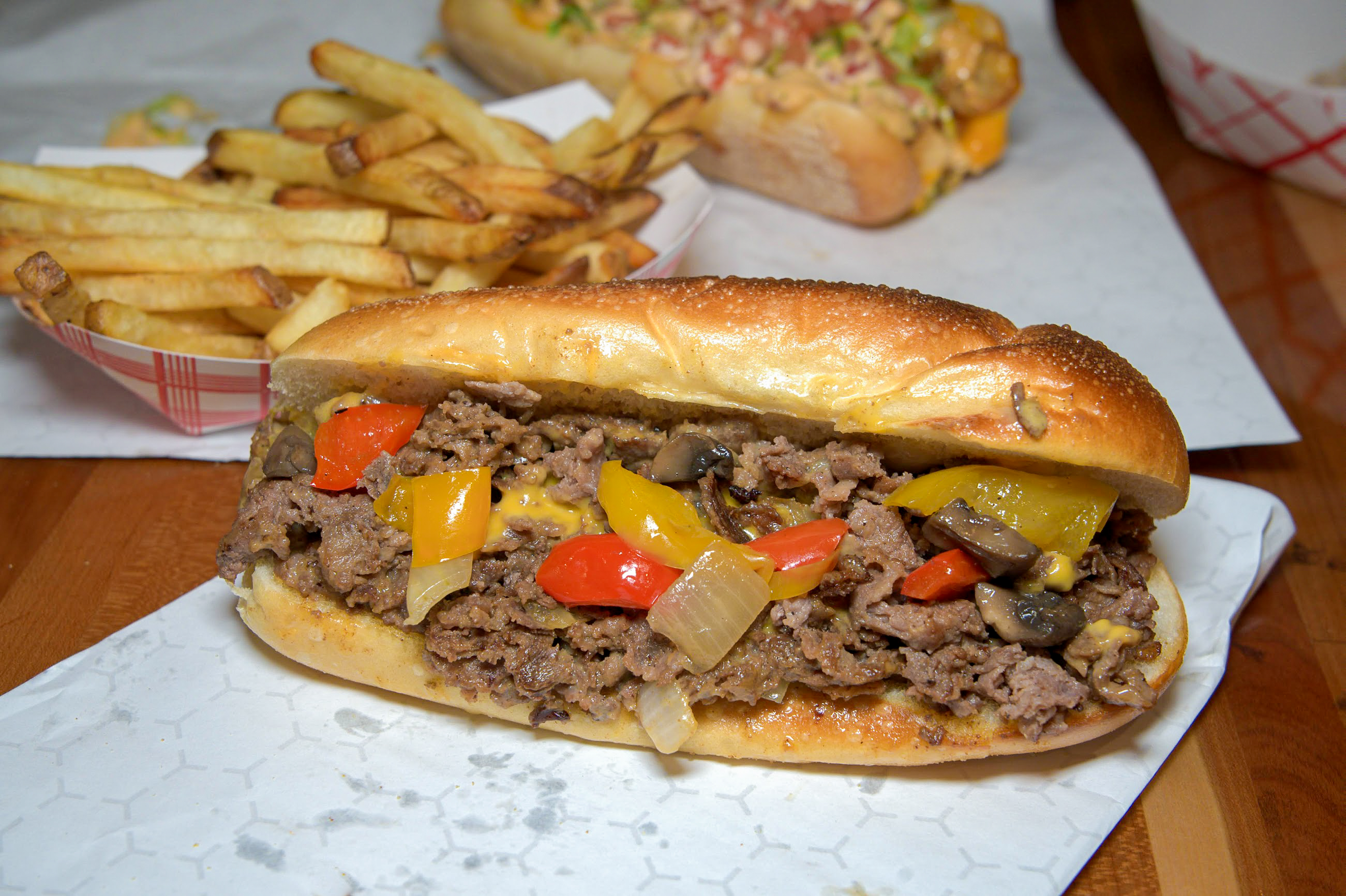 a hot dog on a bun sitting on a table