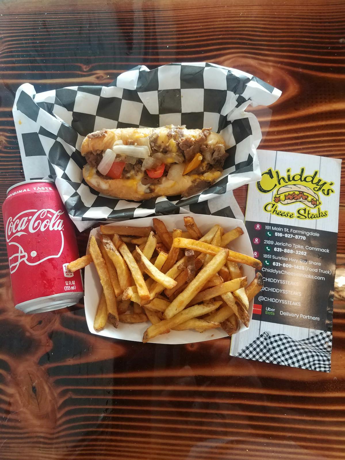 a plate of hot dogs and fries on a table