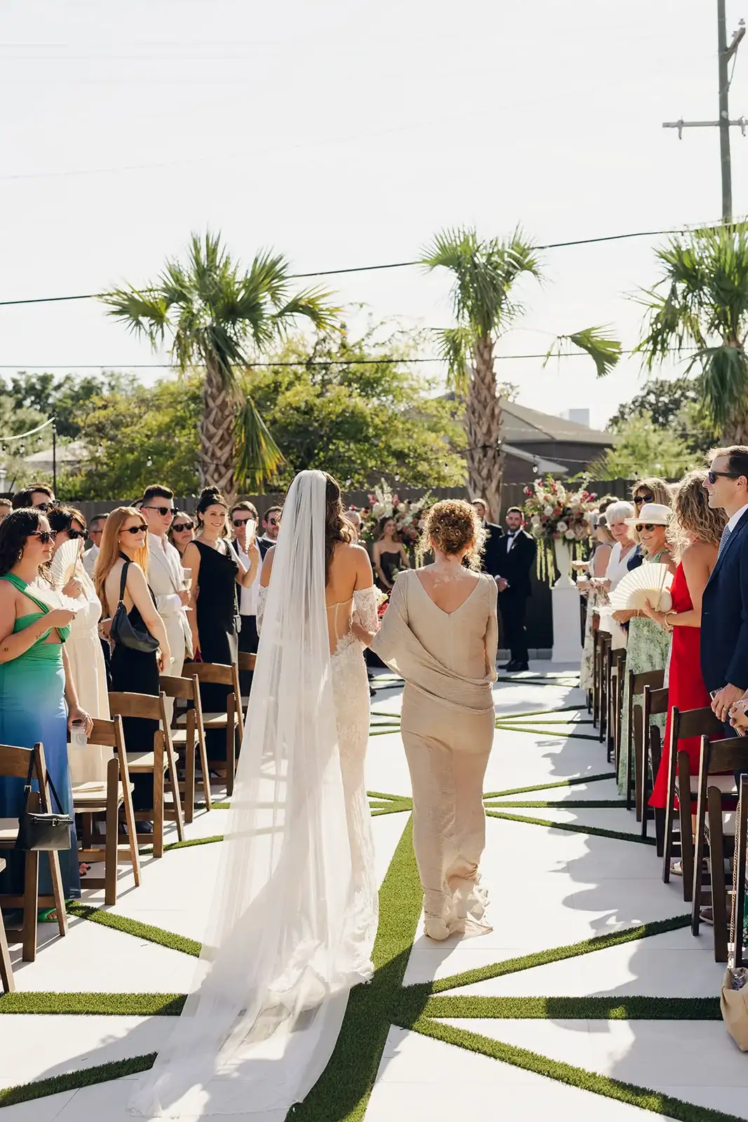 Bride walking down the garden aisle at The Waverly