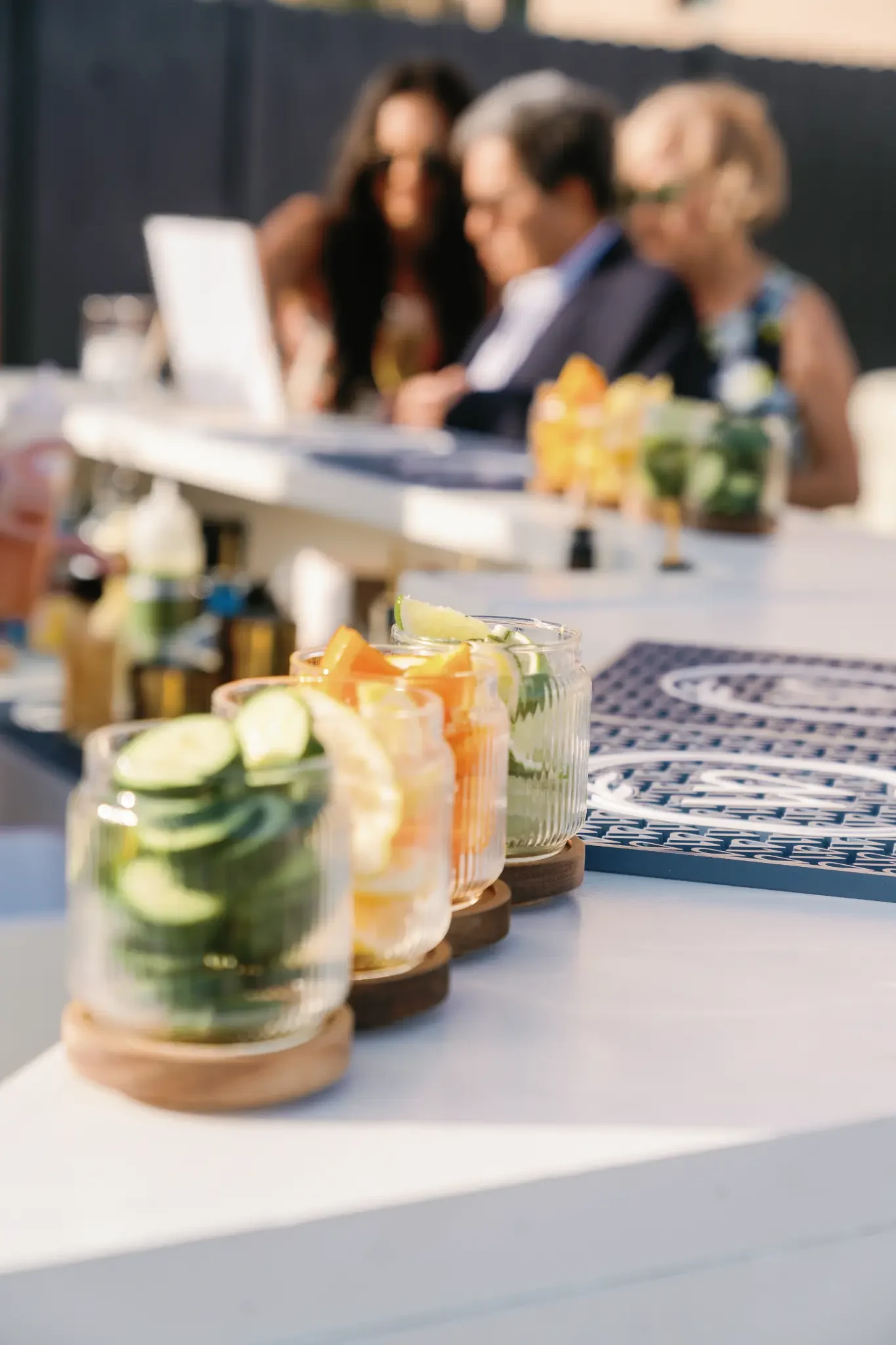 Fresh cucumber, orange and lime garnishes arranged on The Waverly bar