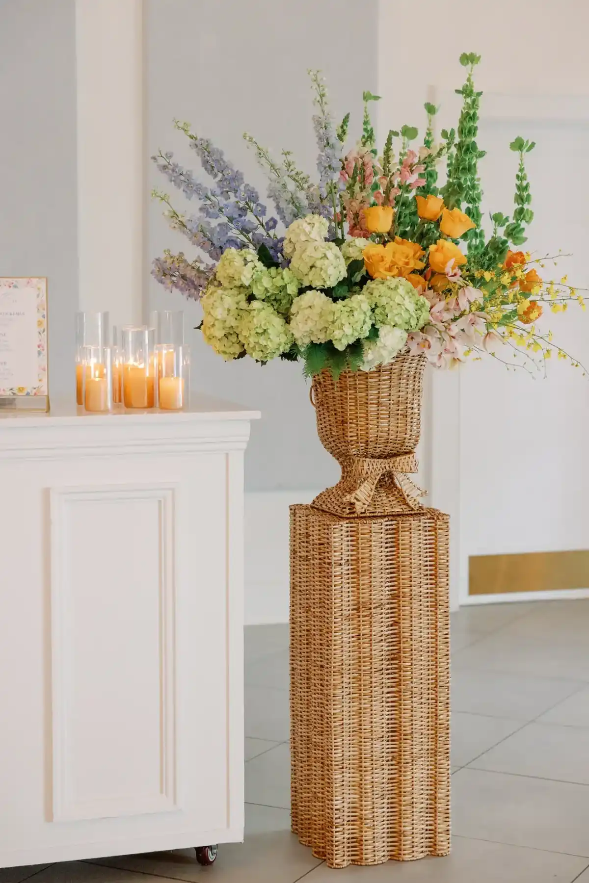 Floral arrangement and candles in the reception hall