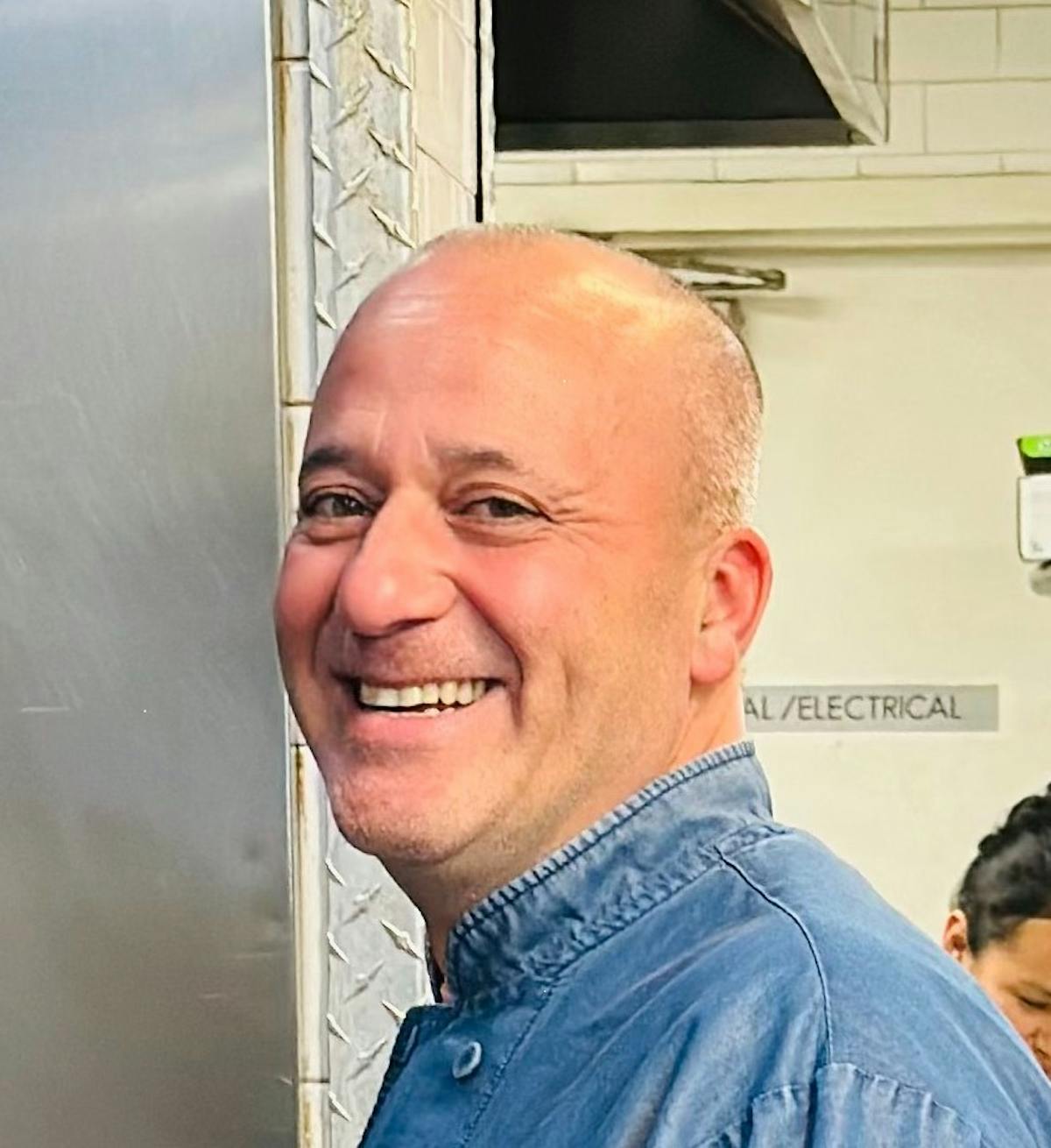 a man standing in front of a window