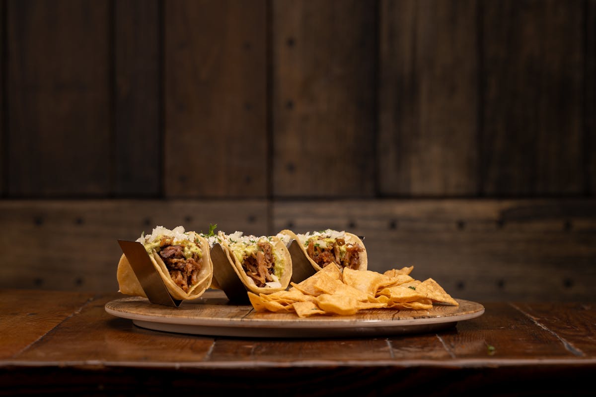 a plate of food sitting on top of a wooden table