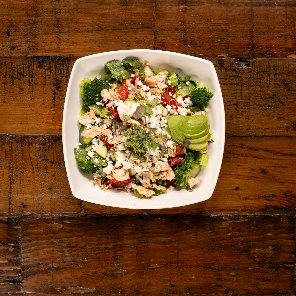 a bowl of salad on a plate