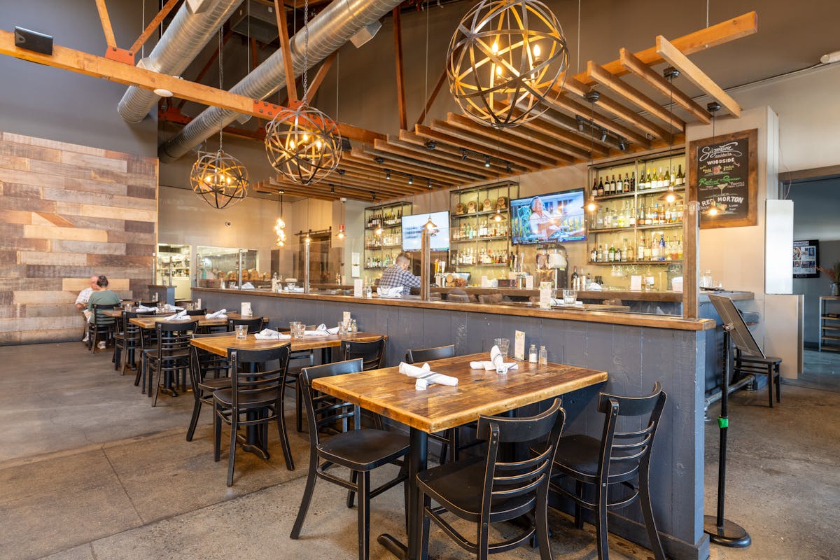 a kitchen with a table in a restaurant