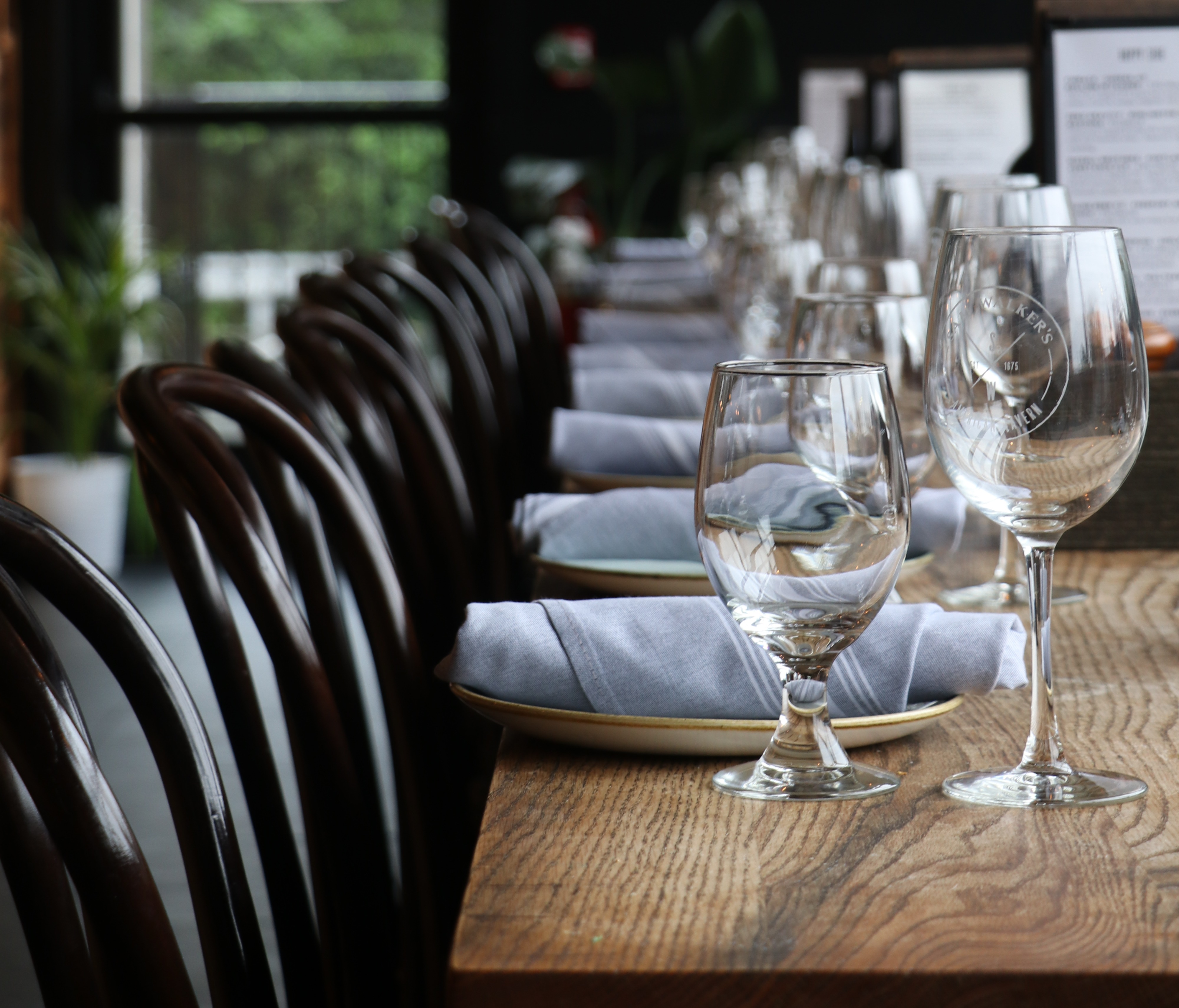 a dining table filled with wine glasses