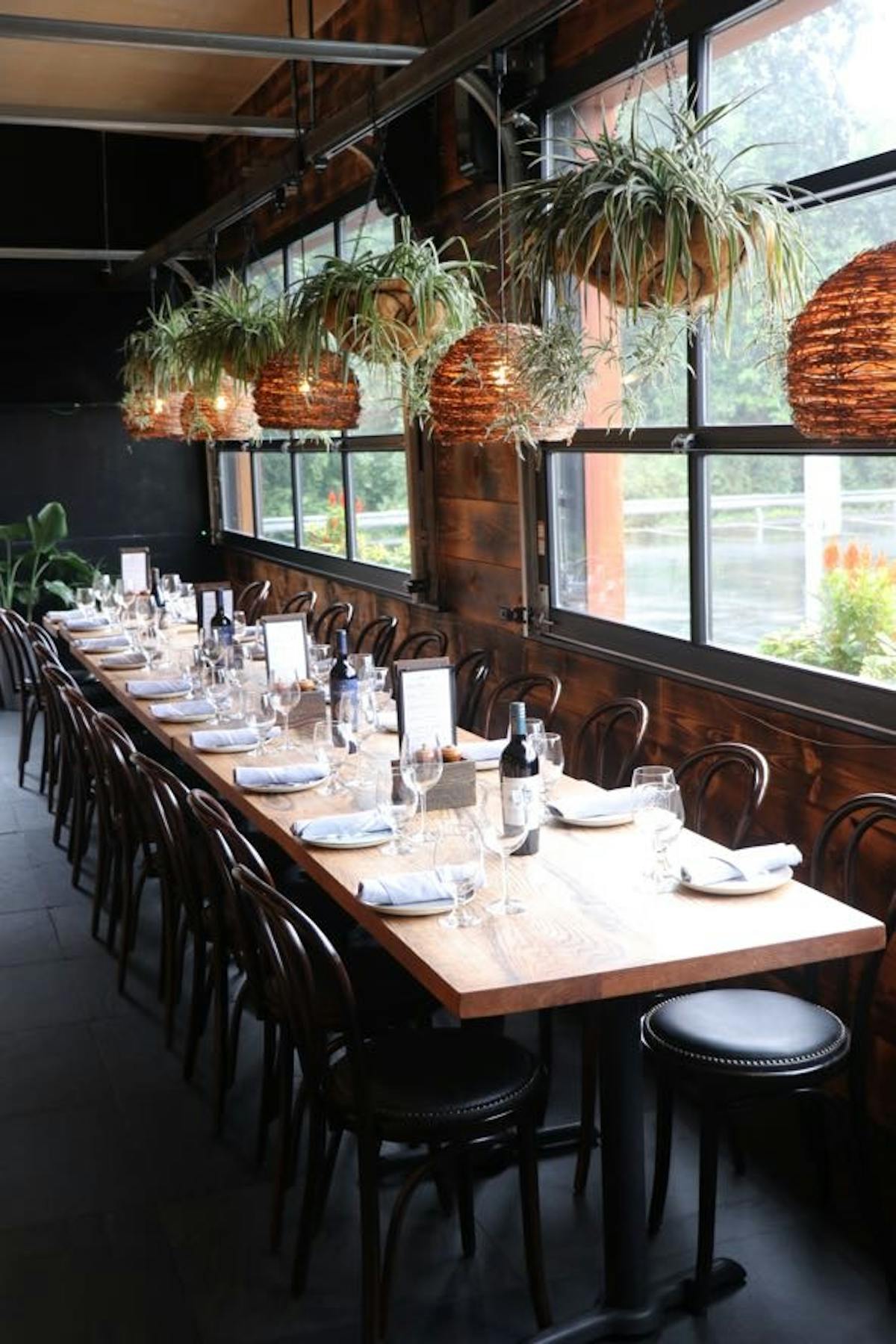 a dining room table in front of a window