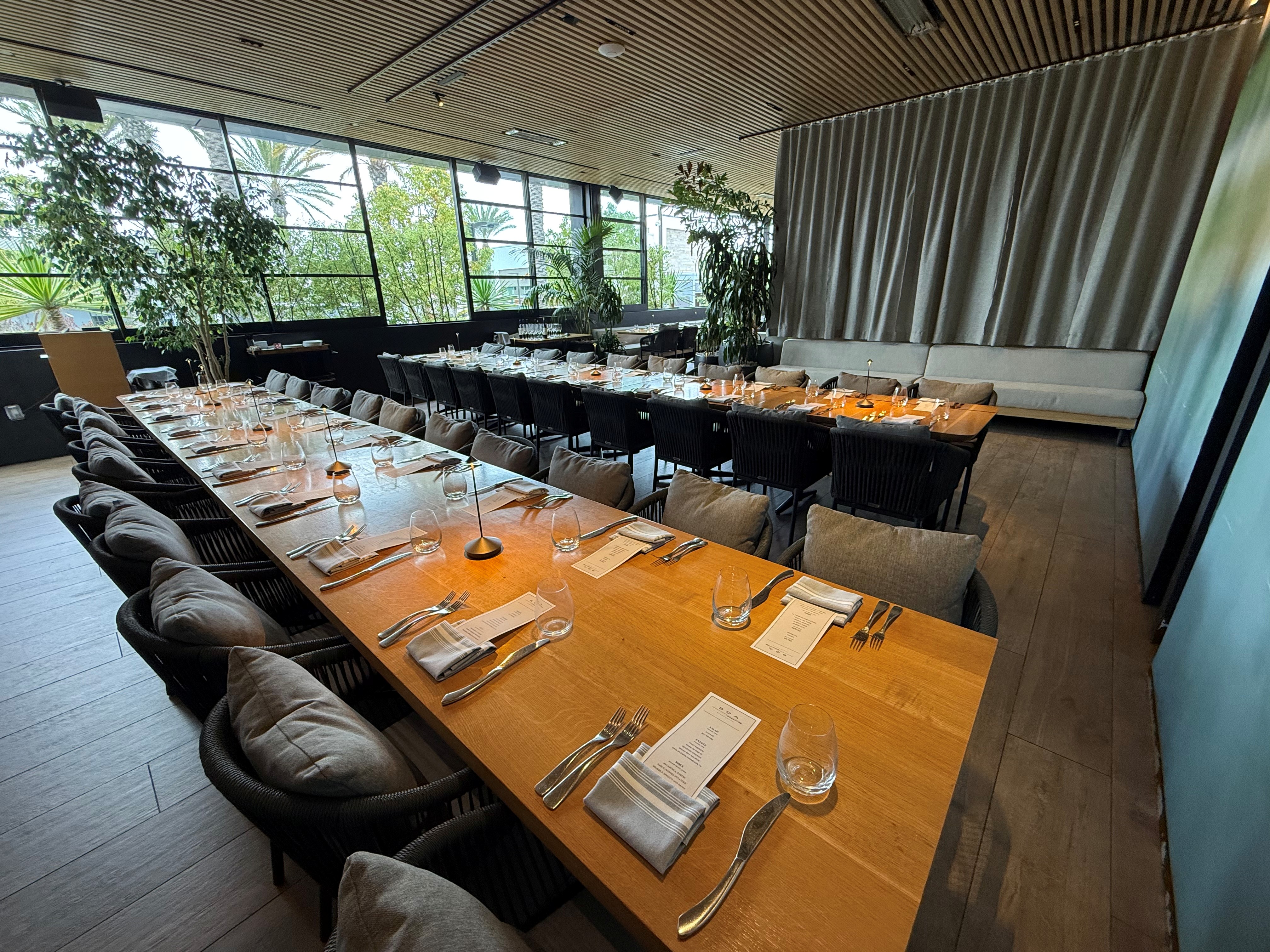 a large dining room with tables and chairs