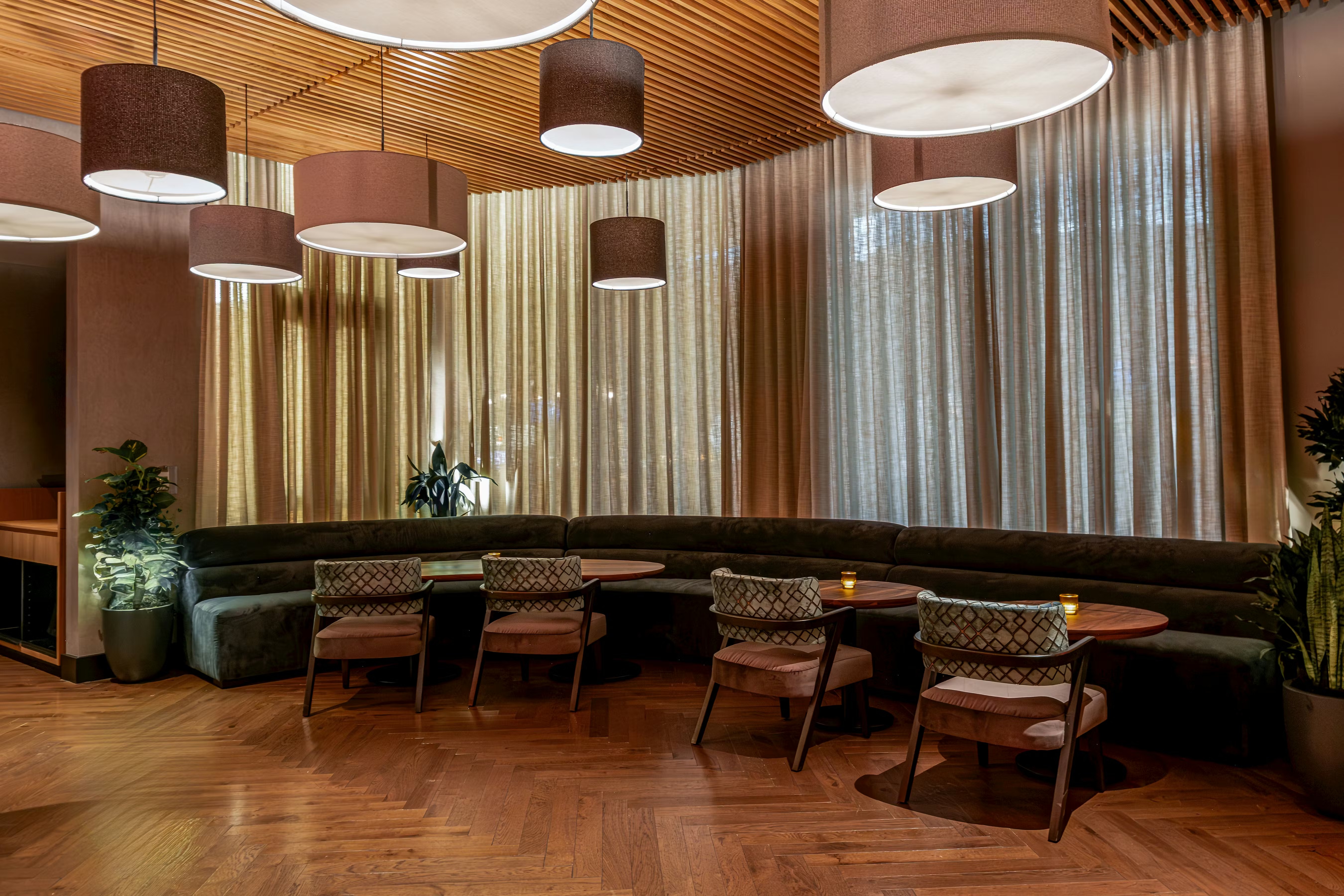 a room with a couch and chairs