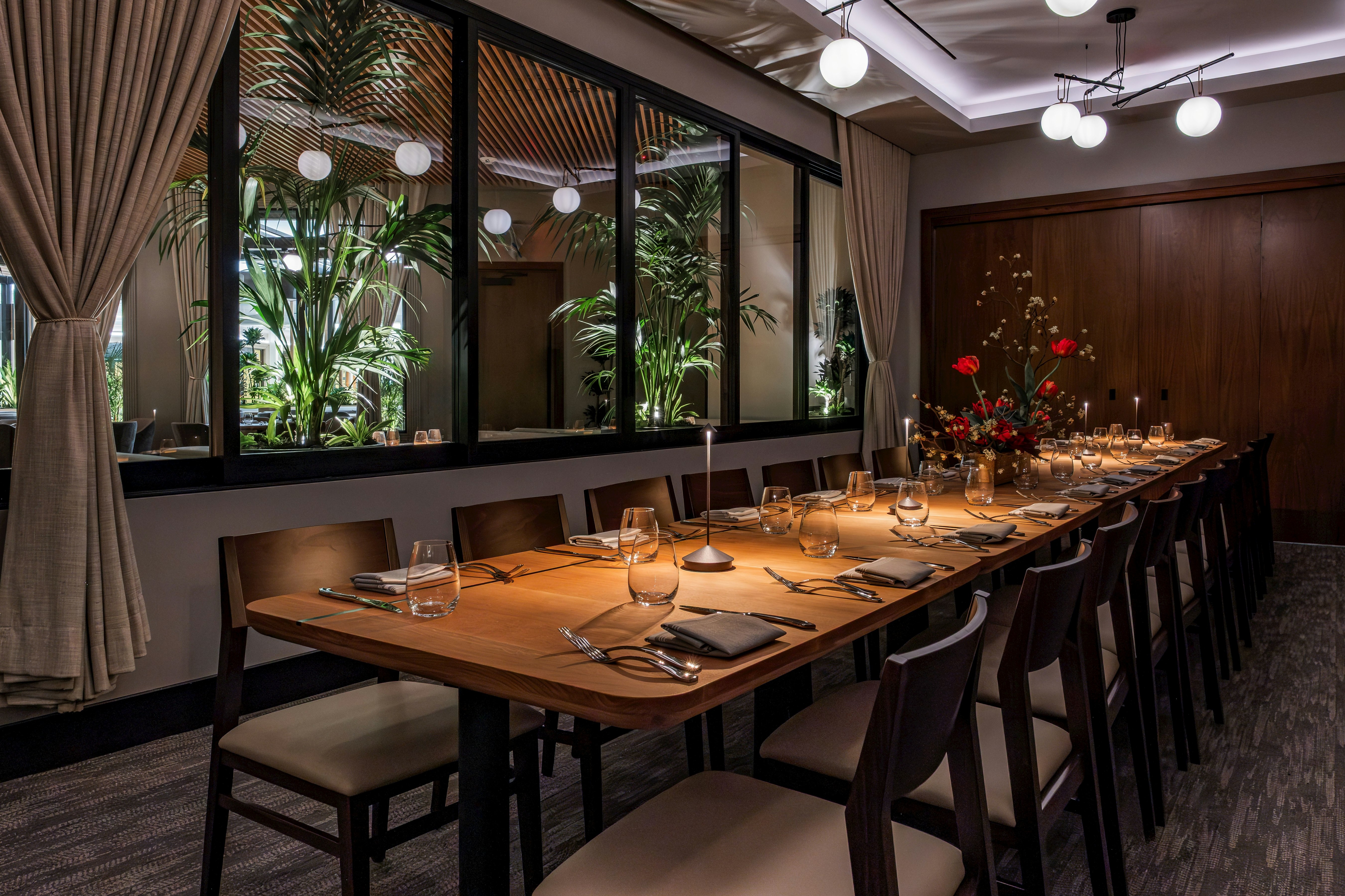 a table with chairs and glasses