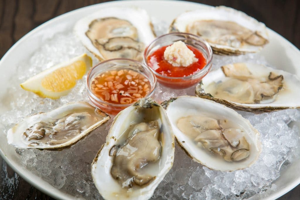 a plate filled with oysters