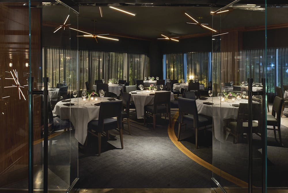 a room filled with furniture and a large window