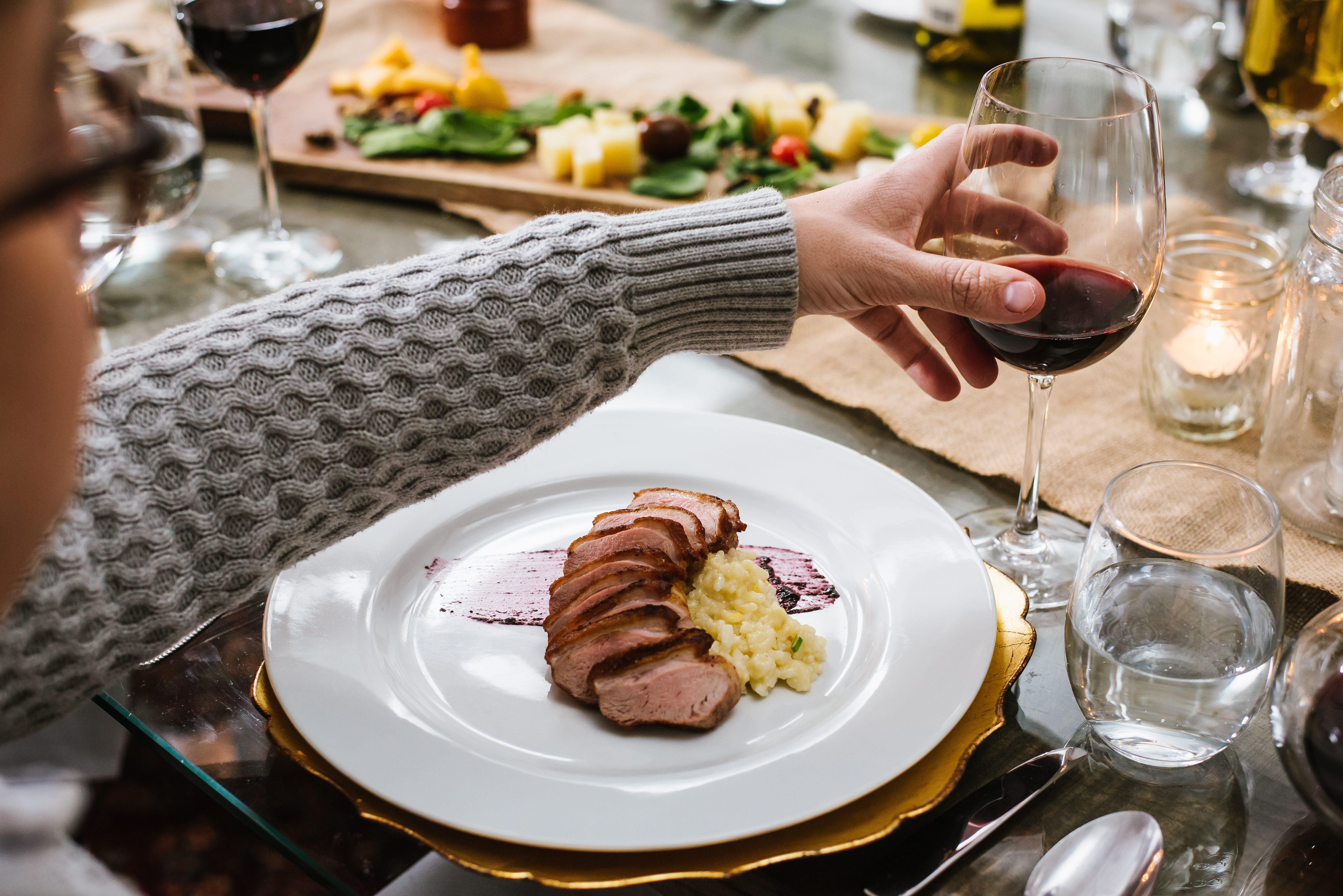 a plate of food and a glass of wine