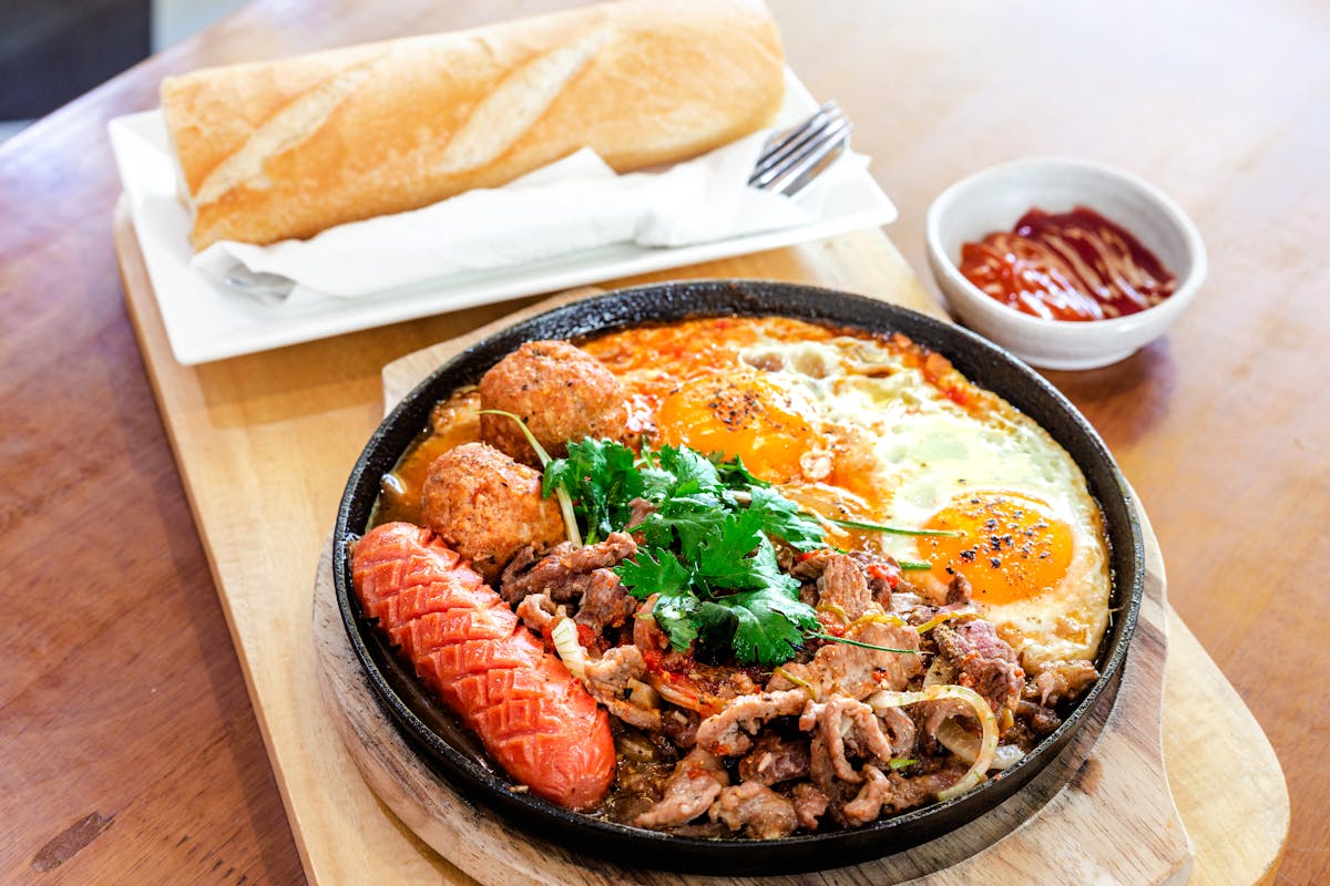 a plate of food sitting on top of a wooden table