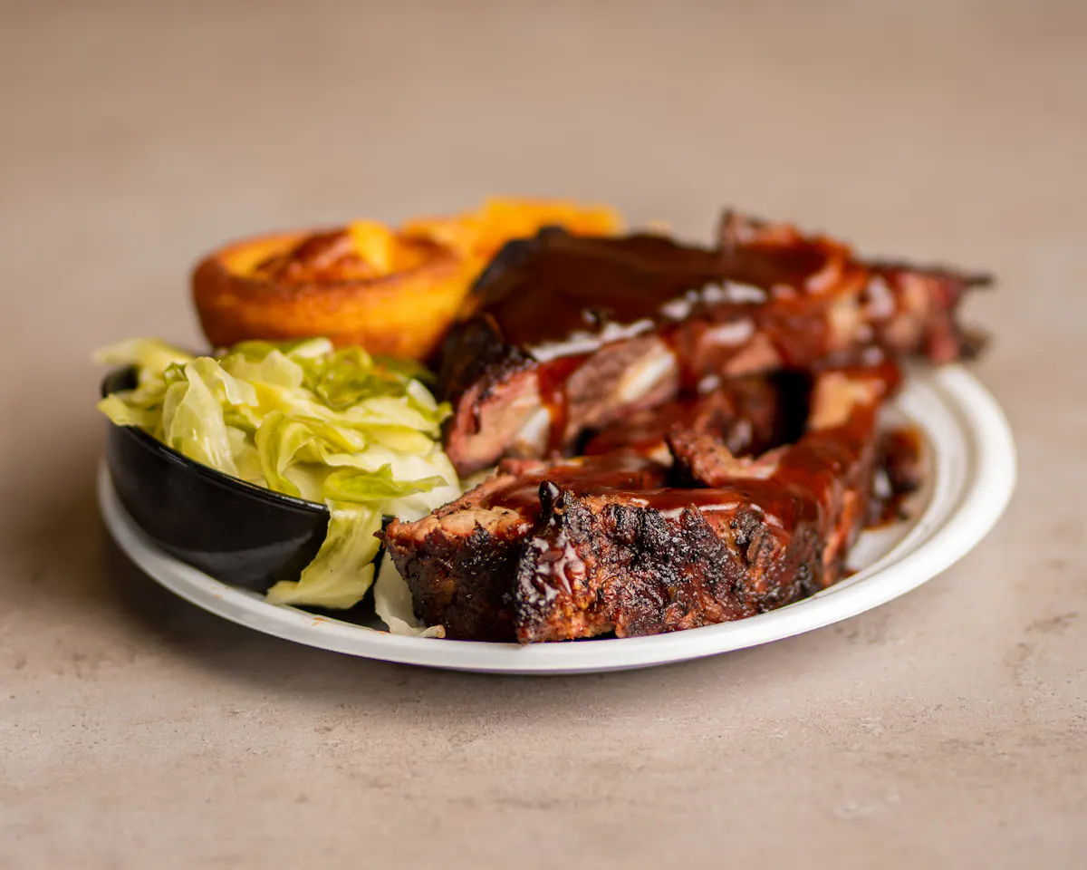 ribs with a salad and biscuit