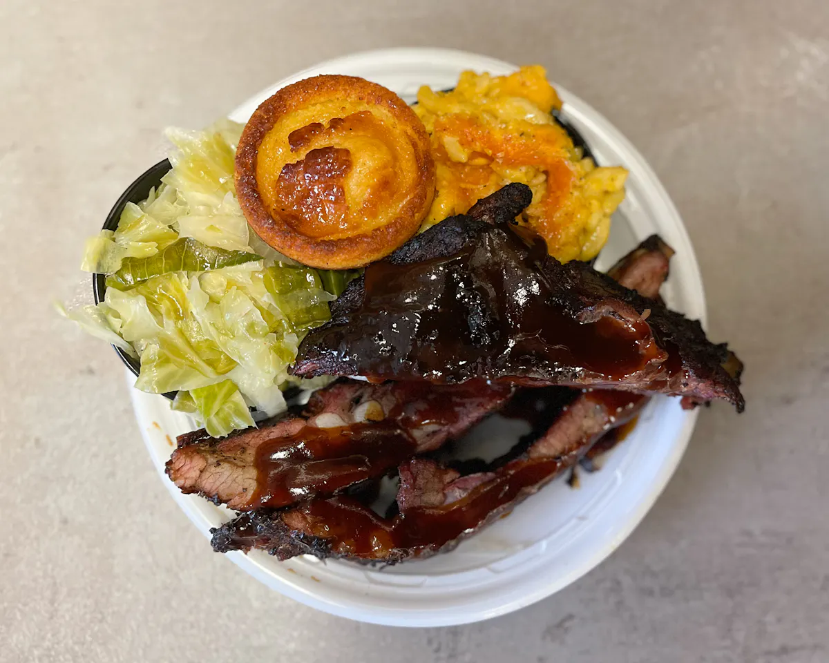 ribs with a salad and biscuit