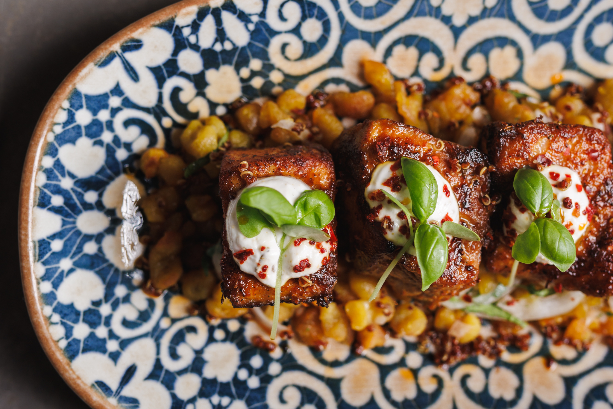 Salmon Cubitos  Jerk ginger glaze, cuban sweet potato spatzle, crispy quinoa, basil