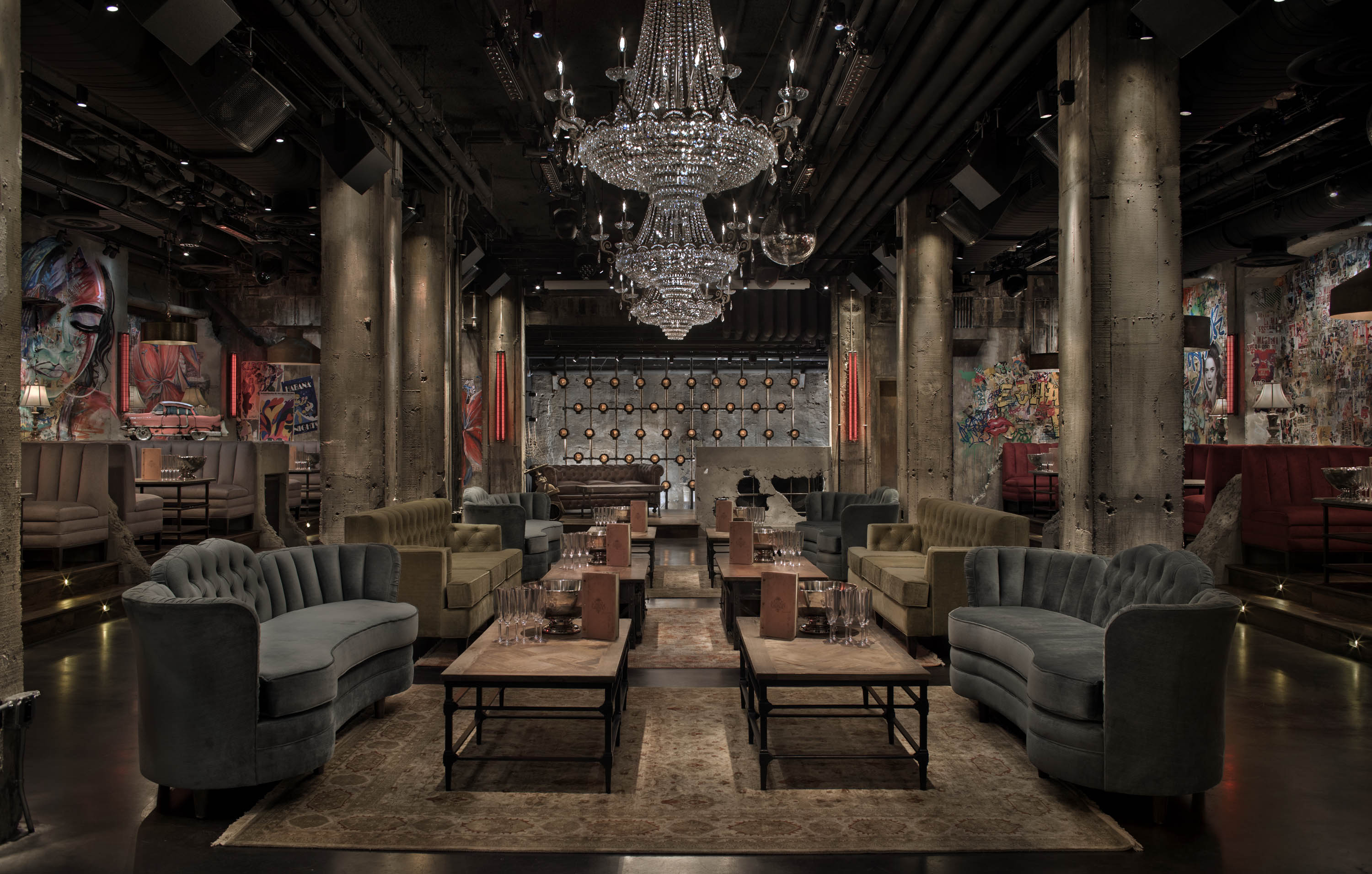 a room filled with furniture and a table in front of a building