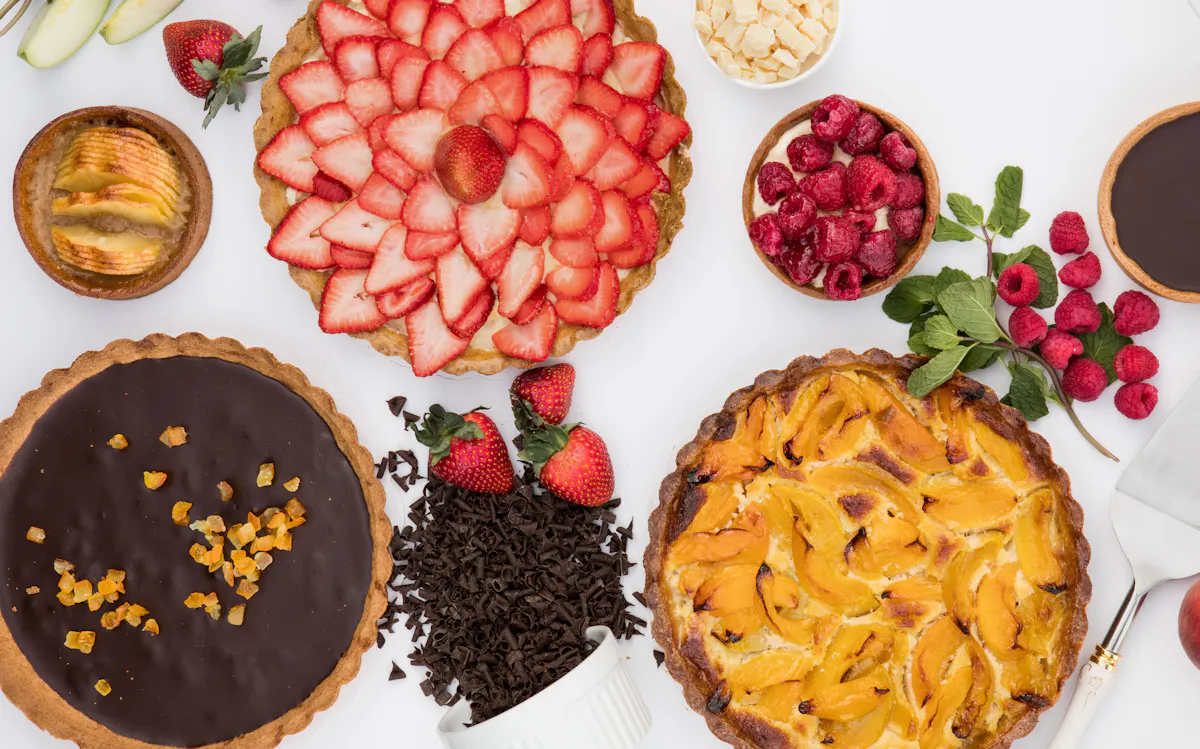 a cake with fruit on top of a table