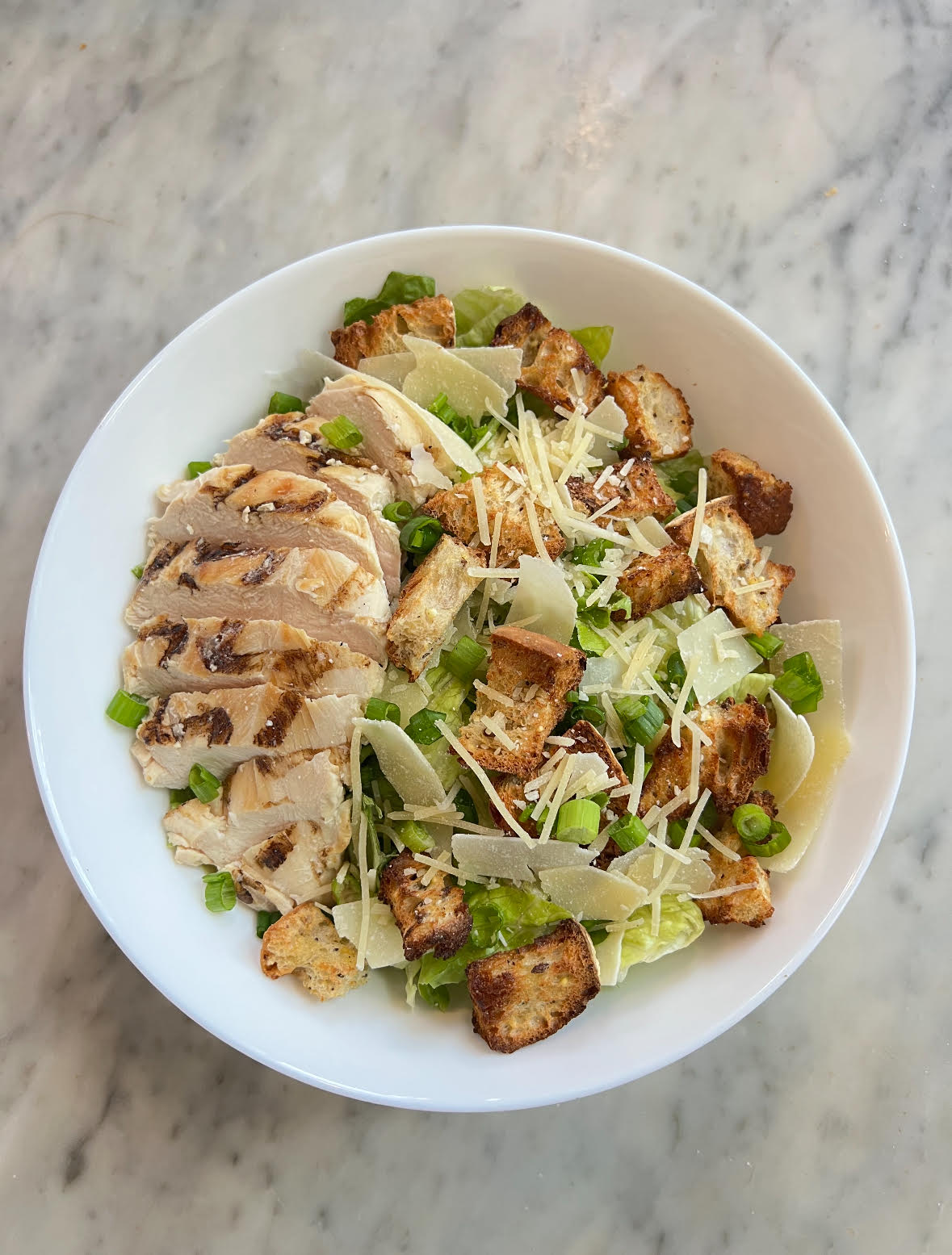 a bowl of salad on a plate