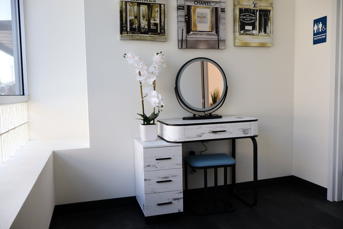 a room with a sink and a mirror