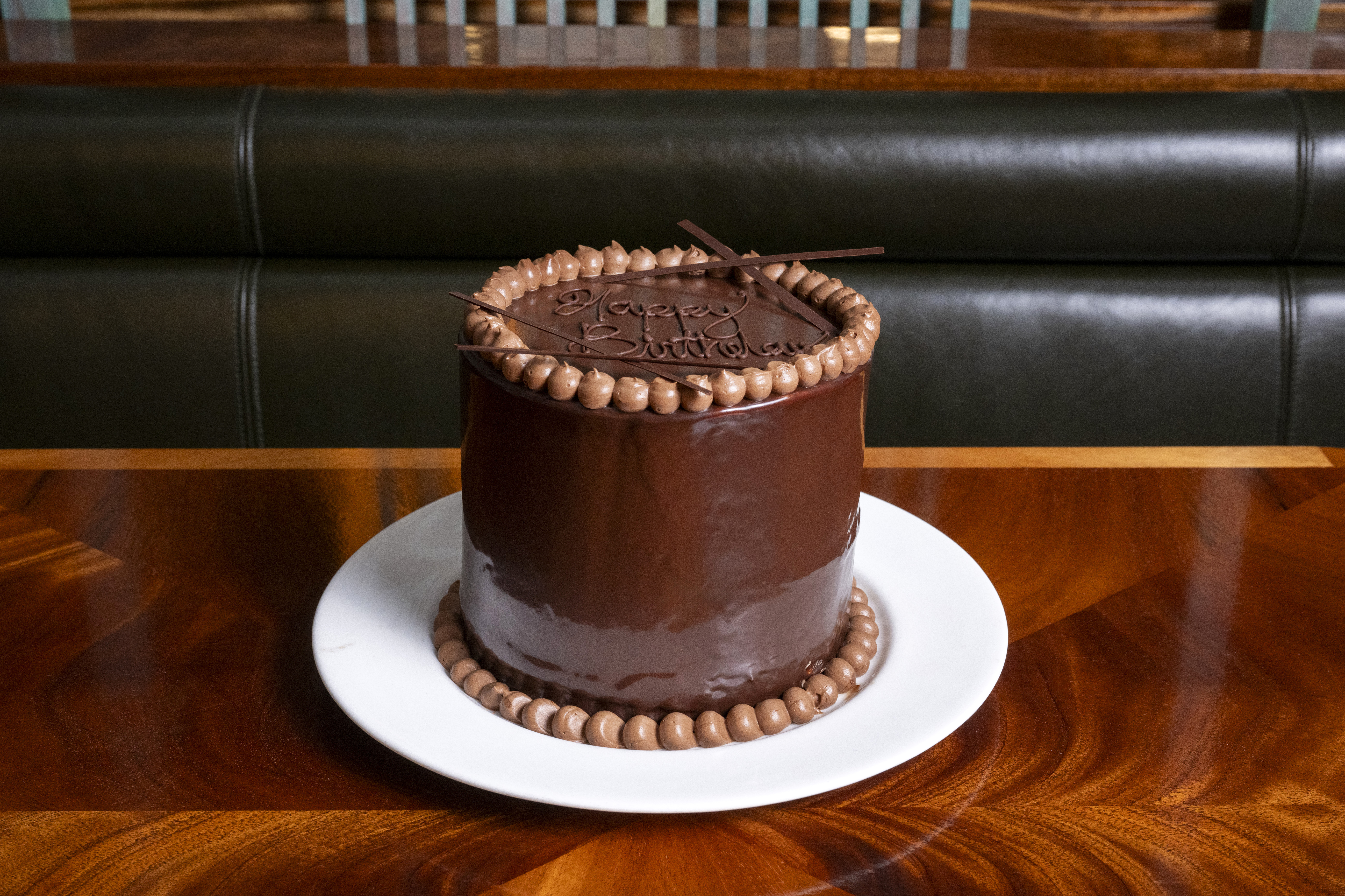 a cake sitting on top of a wooden table