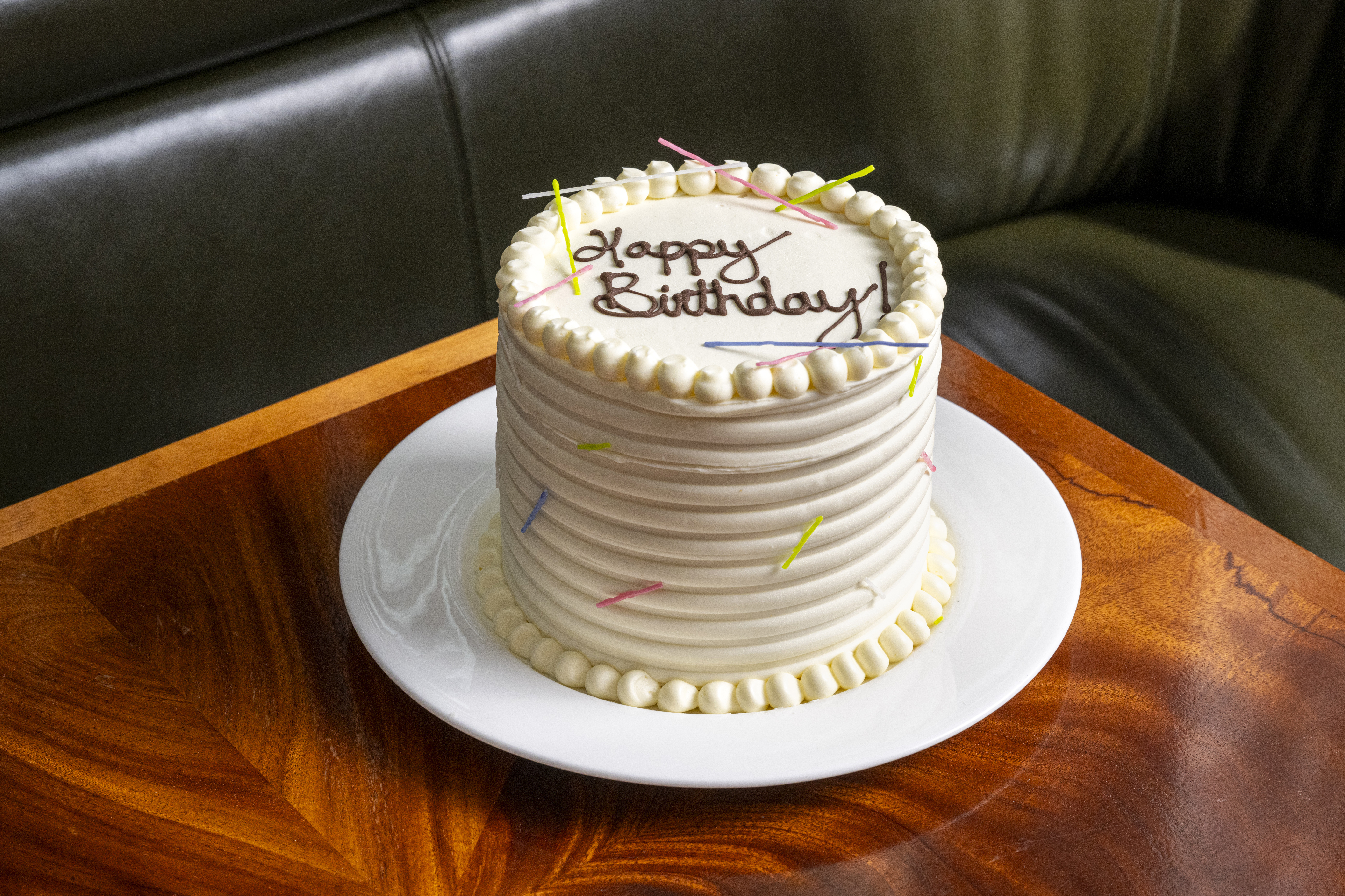 a plate with some cake sitting on top of a table