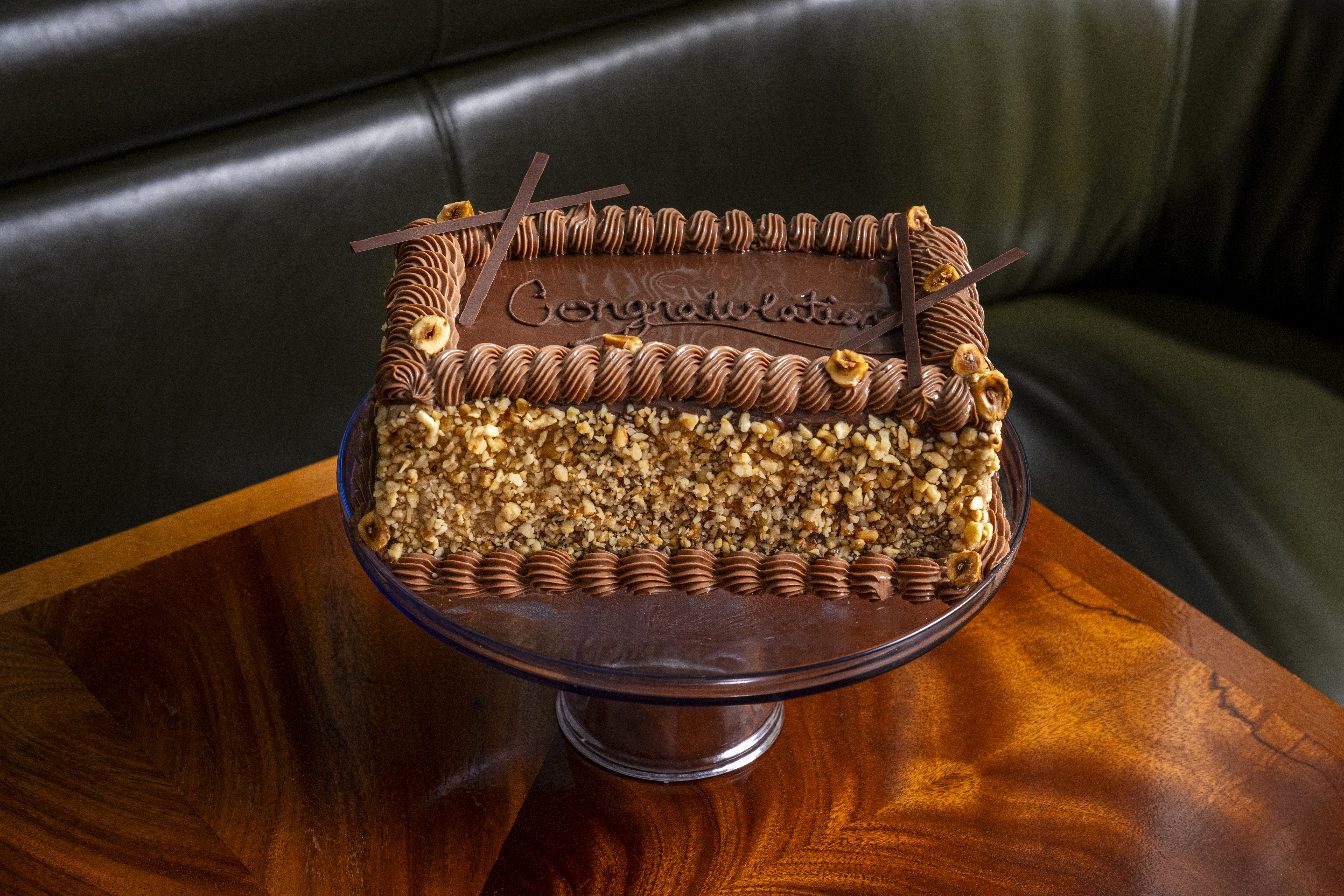 a brown leather couch sitting on top of a table