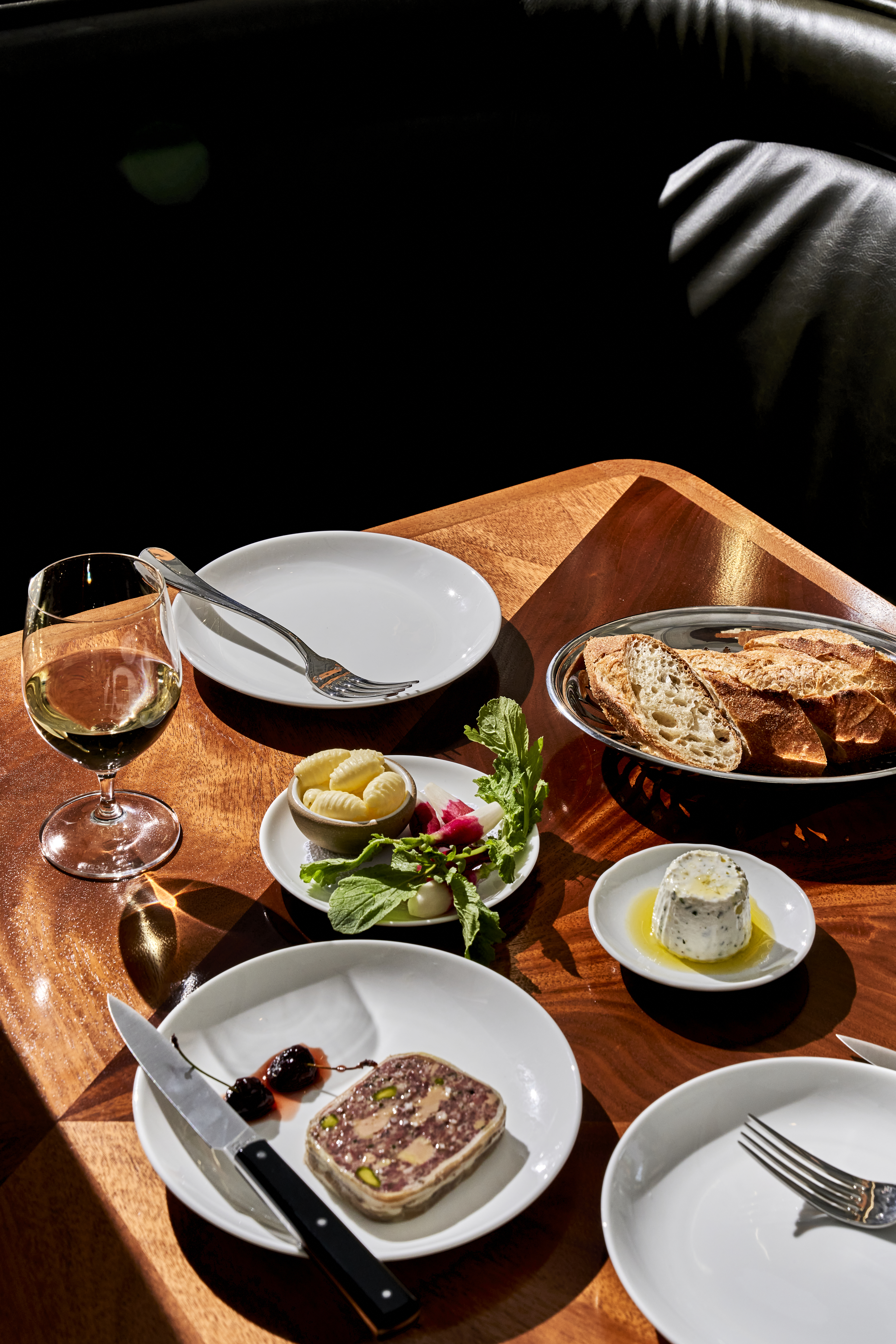 a table full of plates with food