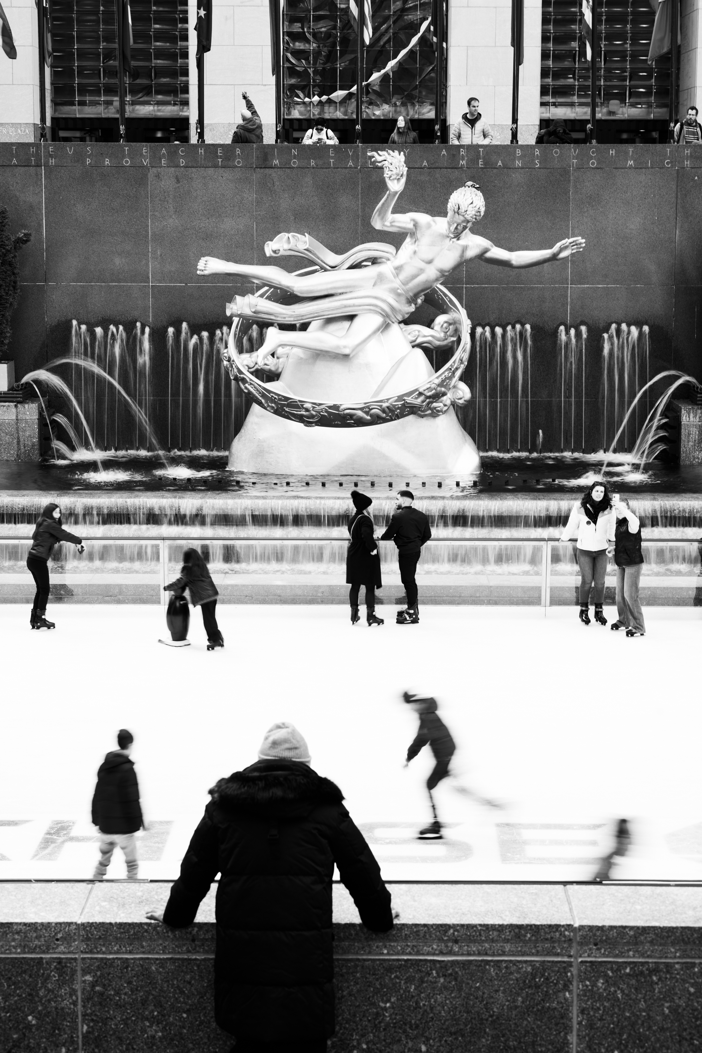 a group of people walking in front of a building