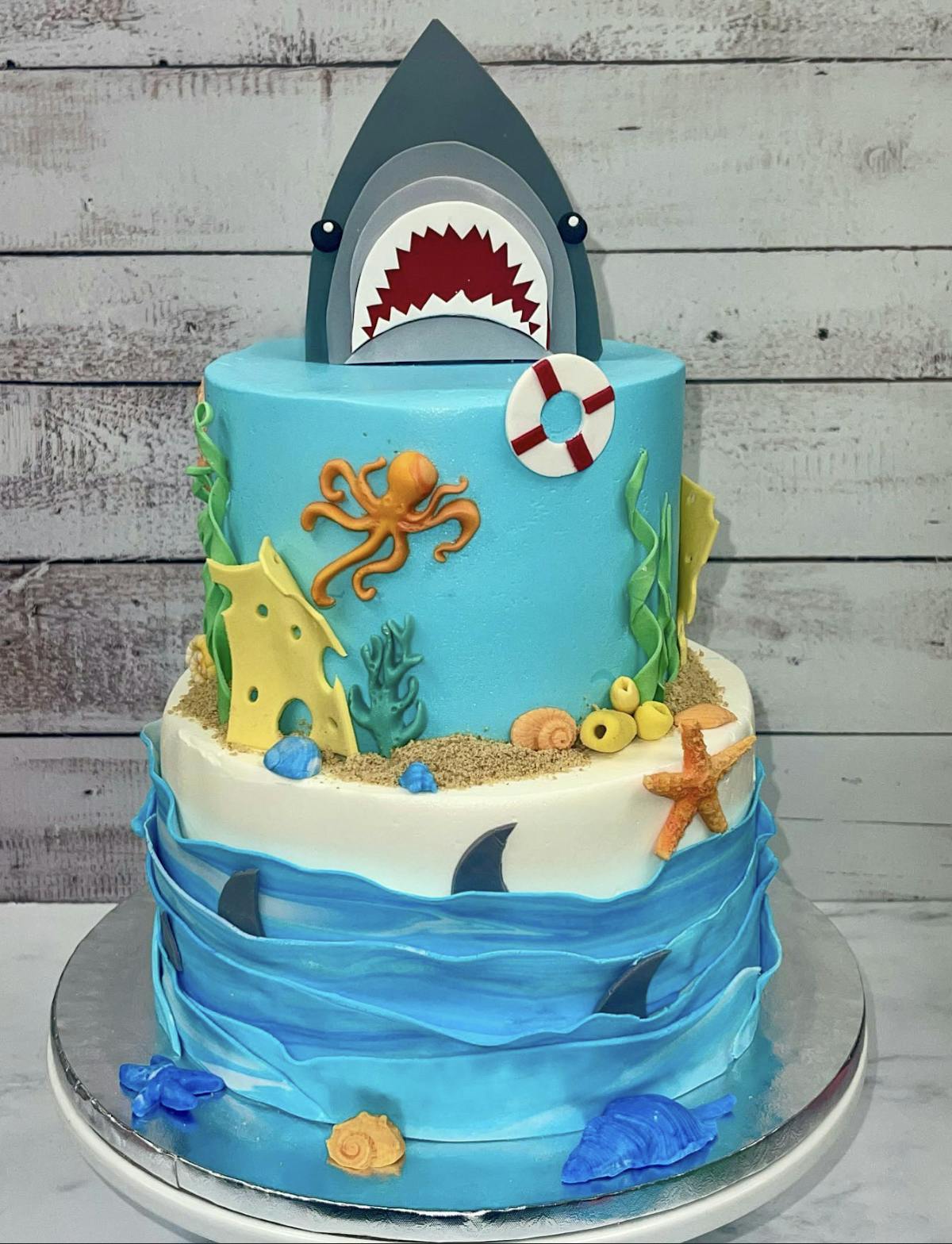 a cake with shark decorations