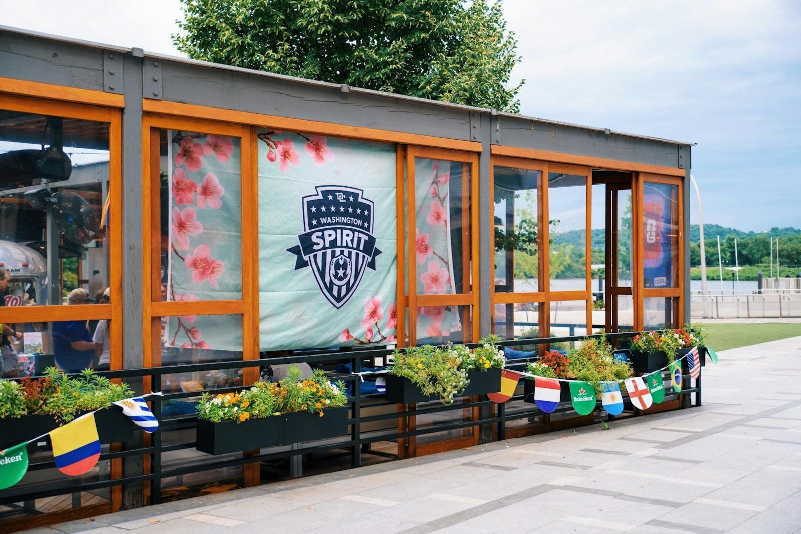 Dacha Beer Garden Navy Yard front patio with a Washington Spirit banner, 79 Potomac Ave SE, Washington DC