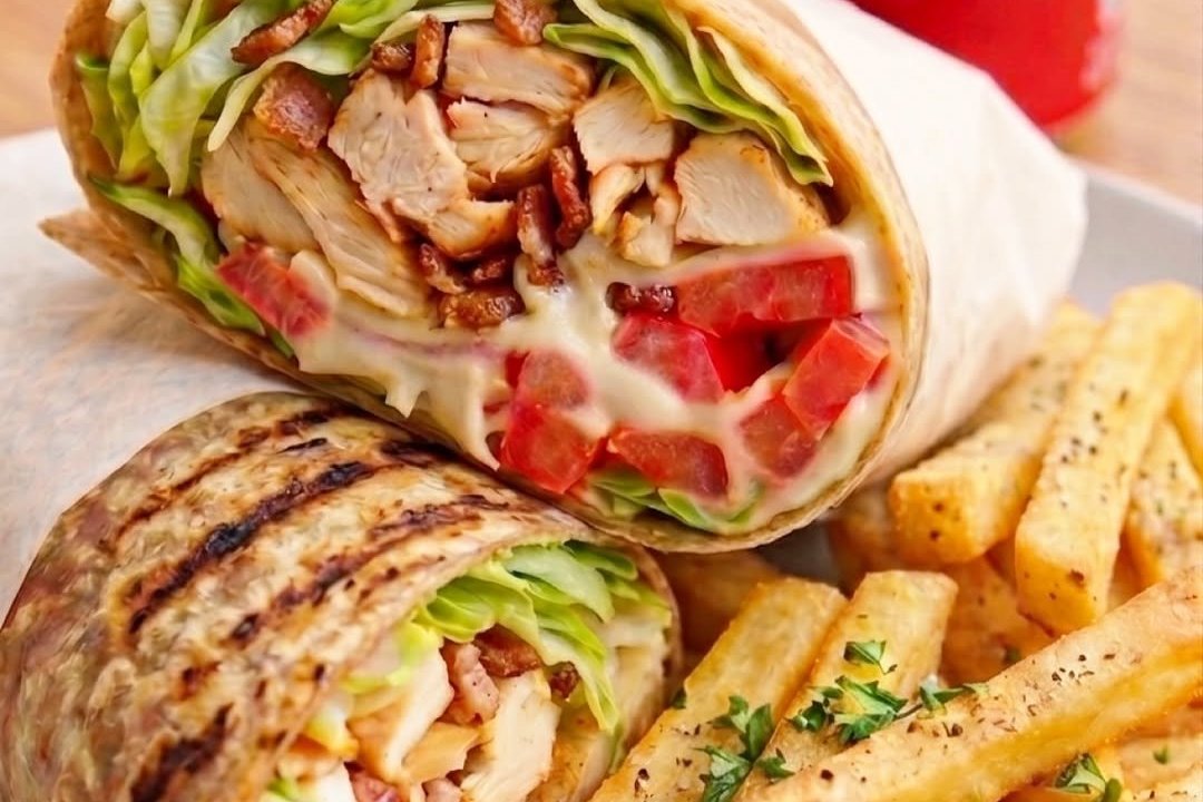 Chicken bacon wrap with fries served for lunch at Dacha Beer Garden Navy Yard, Washington DC