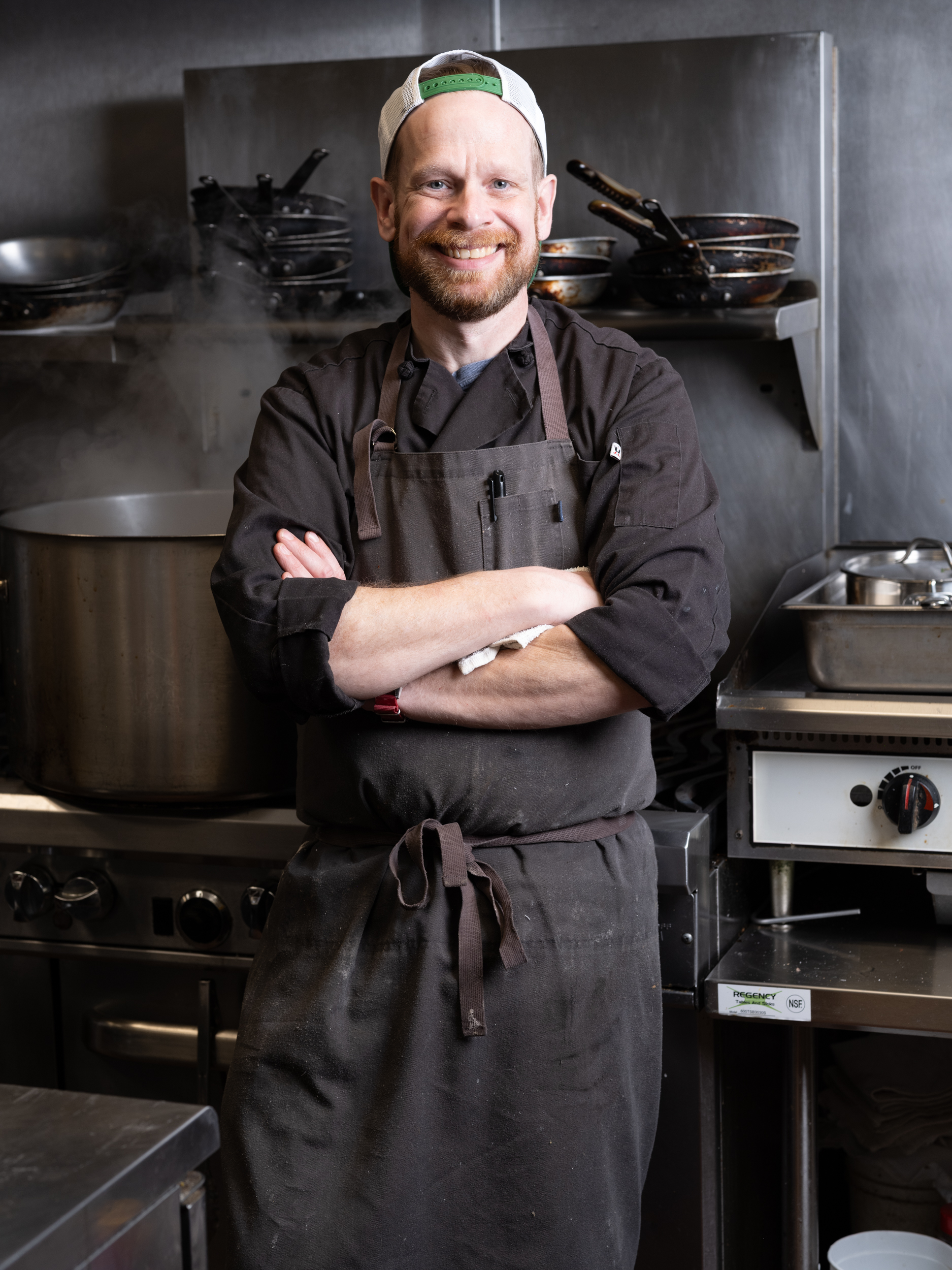 a man standing in a kitchen