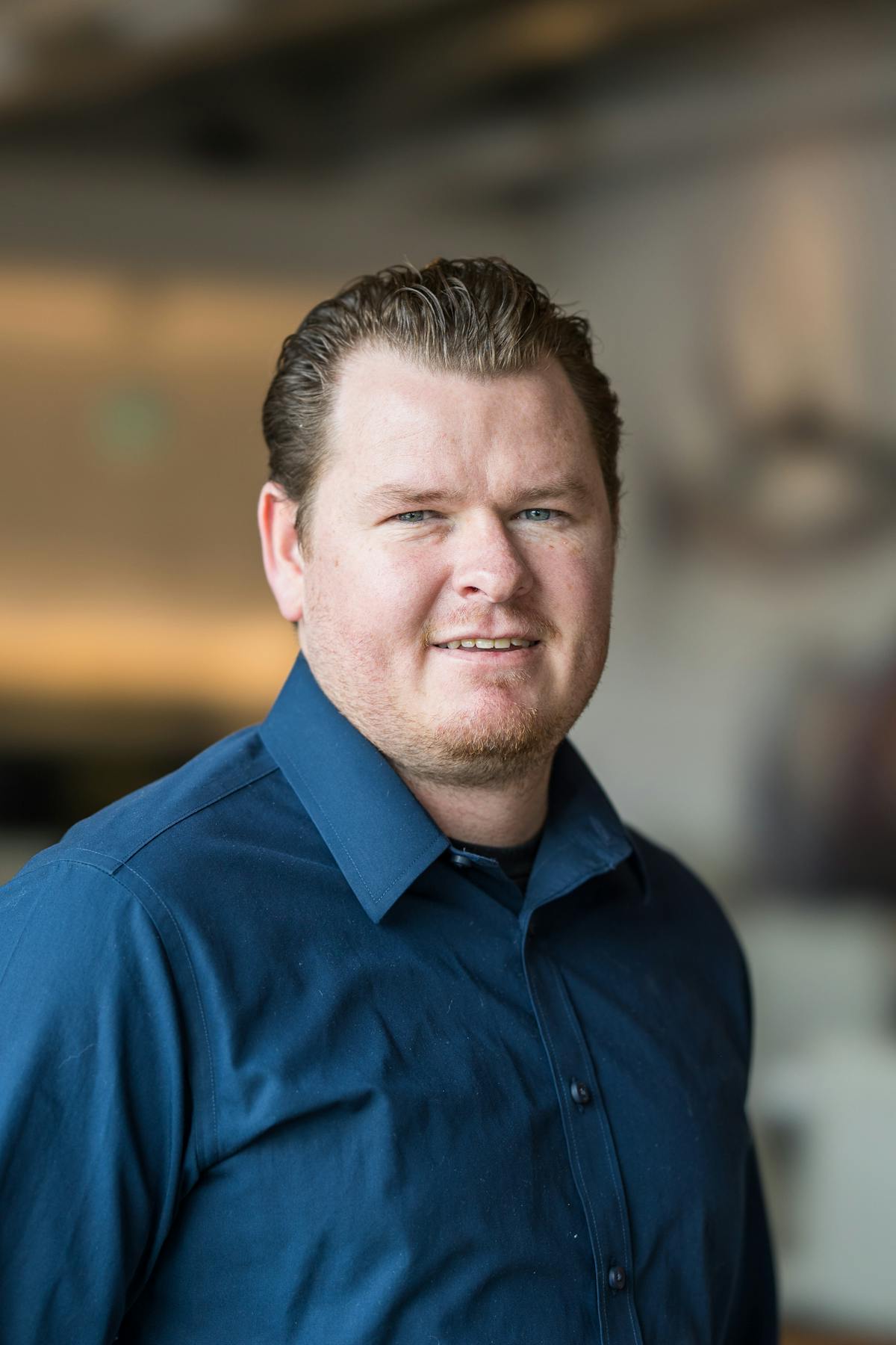 a man wearing a blue shirt