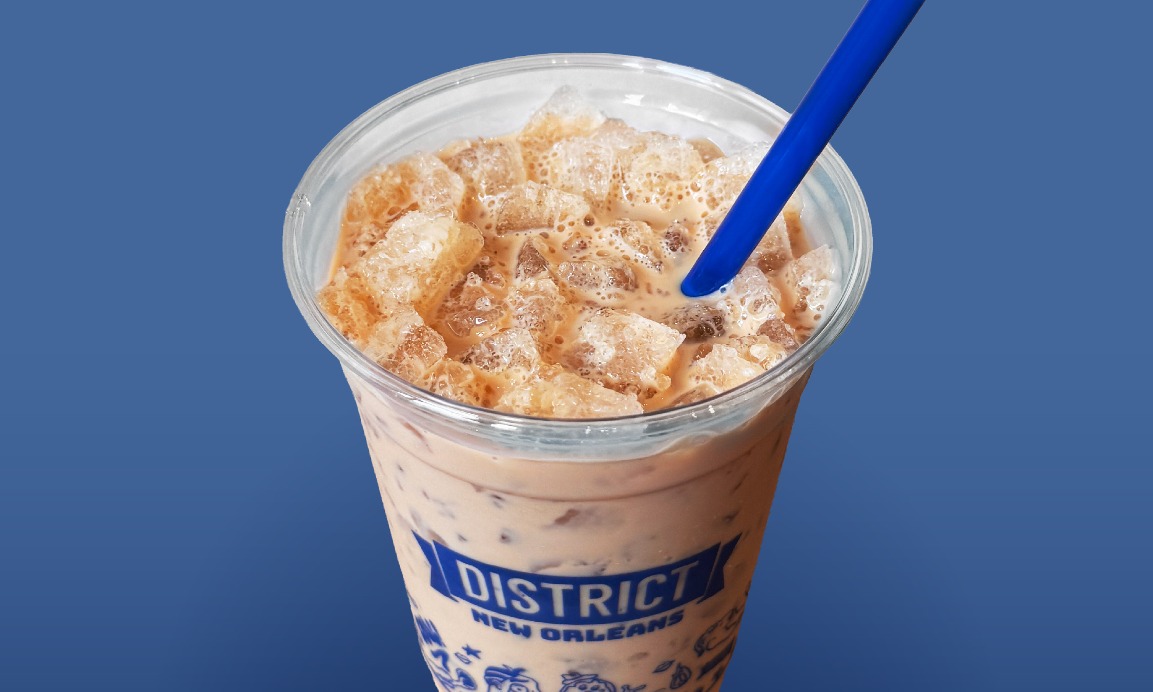 a cup of iced coffee with a straw