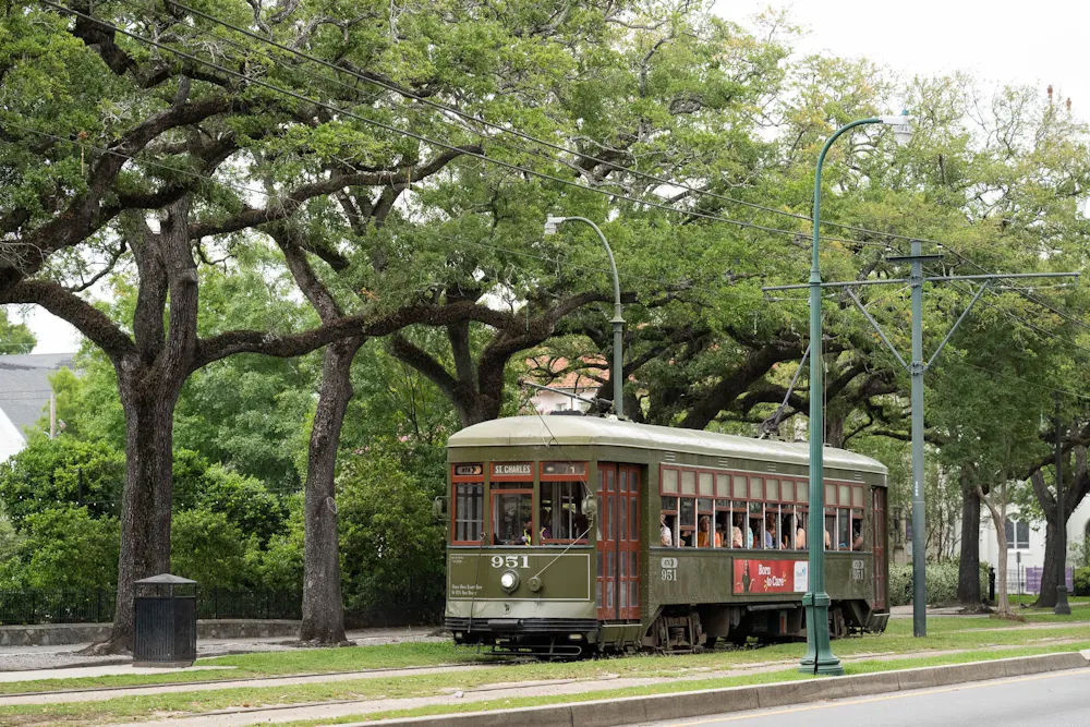 a green trolley on a track