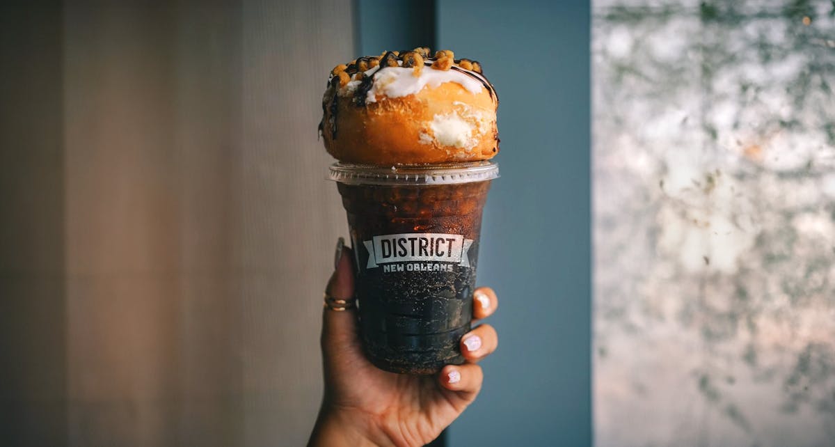 a hand holding a cup