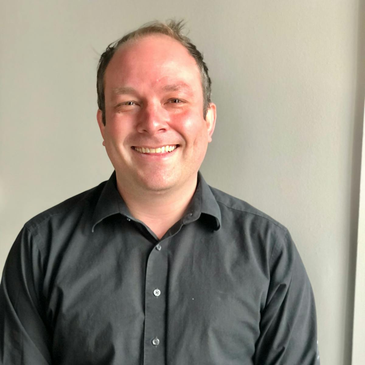 a man smiling for the camera