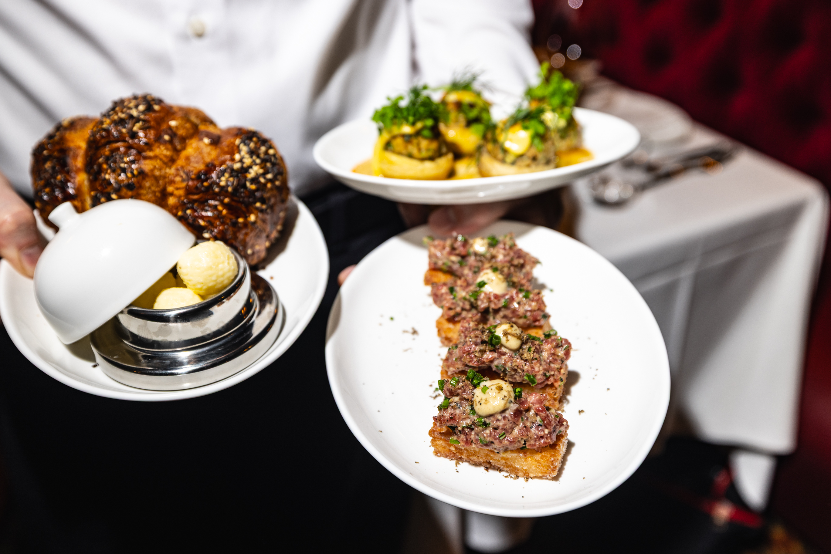 a person holding plates of food
